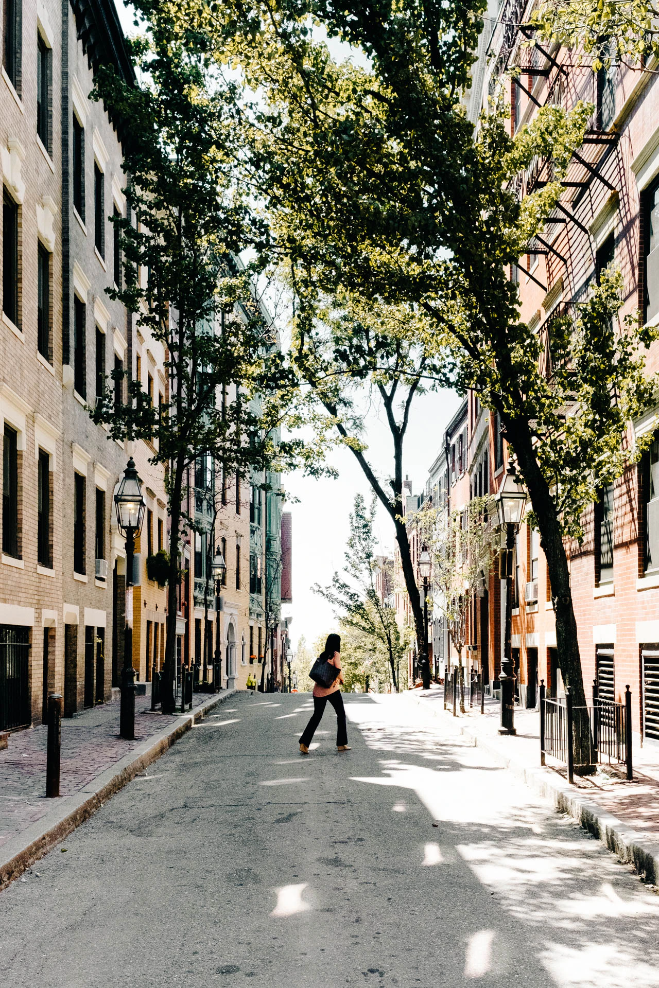 woman crossing the street in Boston