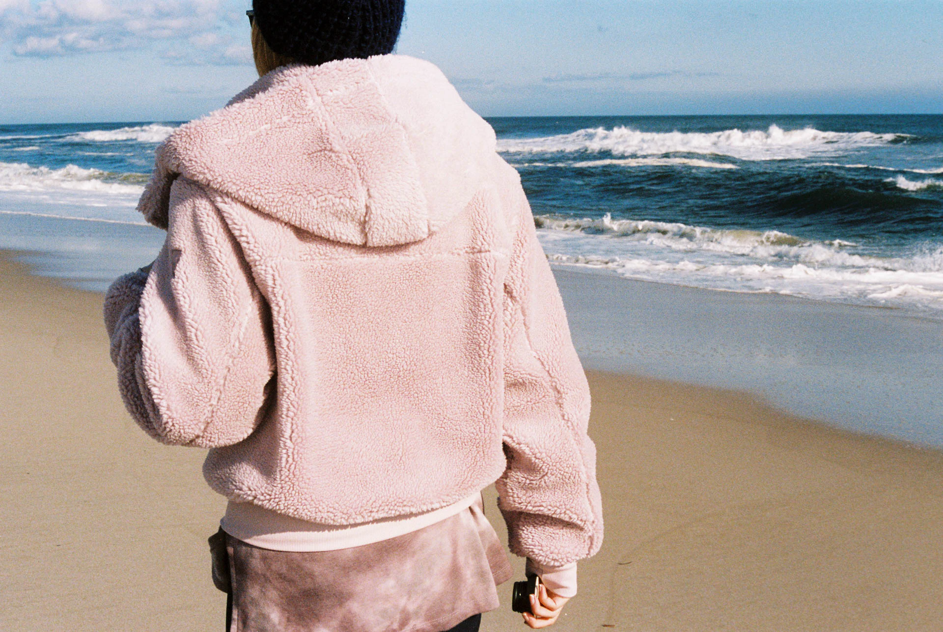 pink coat on the beach on film