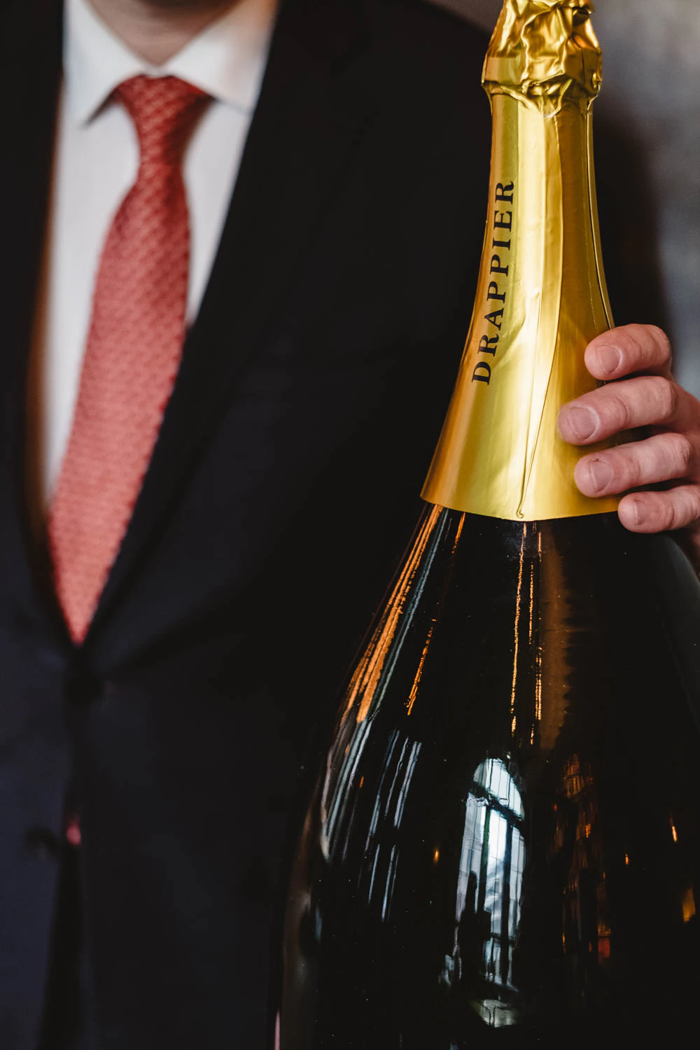 Beverage director of Le Coucou Charles Puglia with Drappier champagne bottle