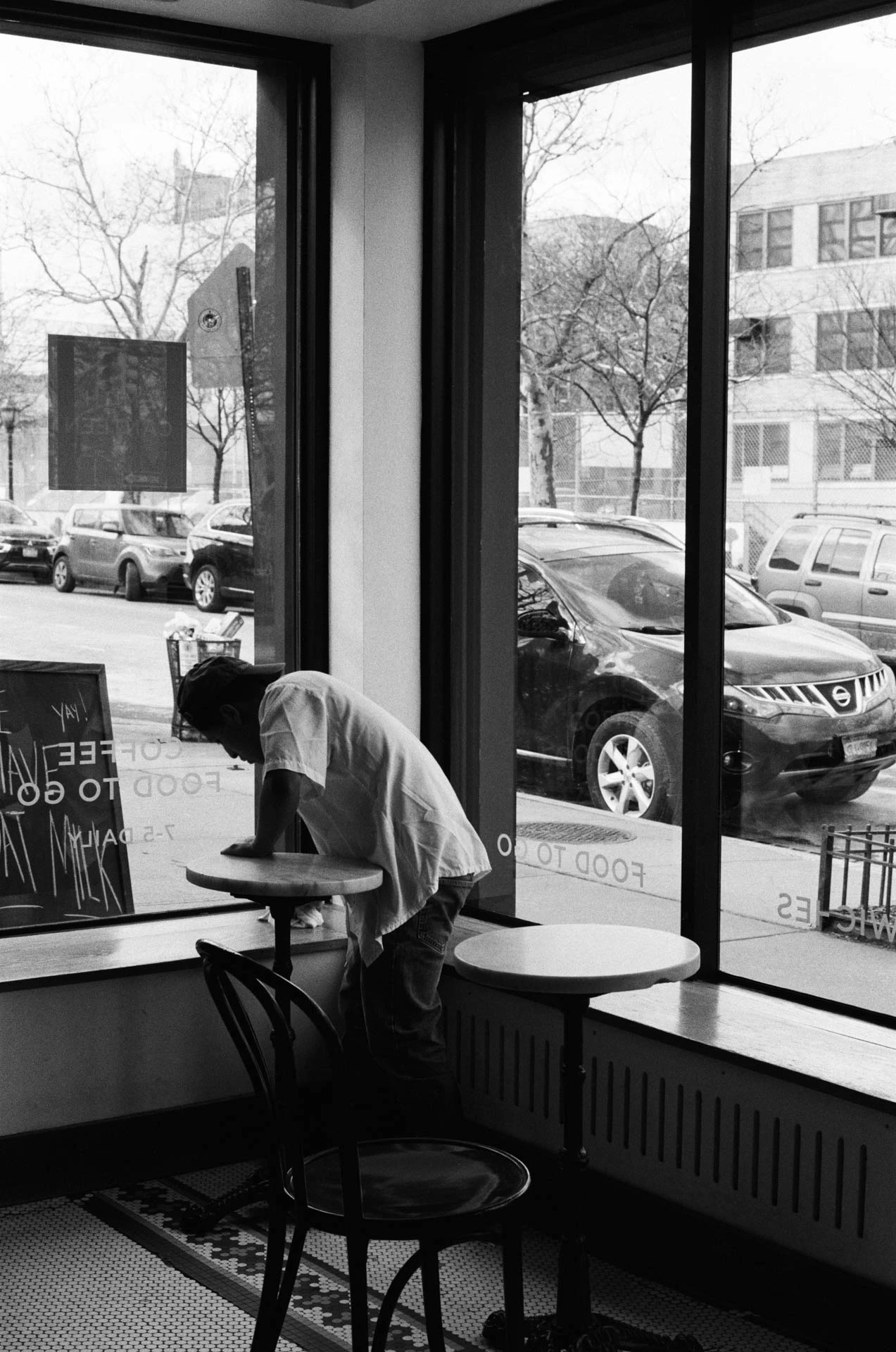 man bussing table at smith canteen on film