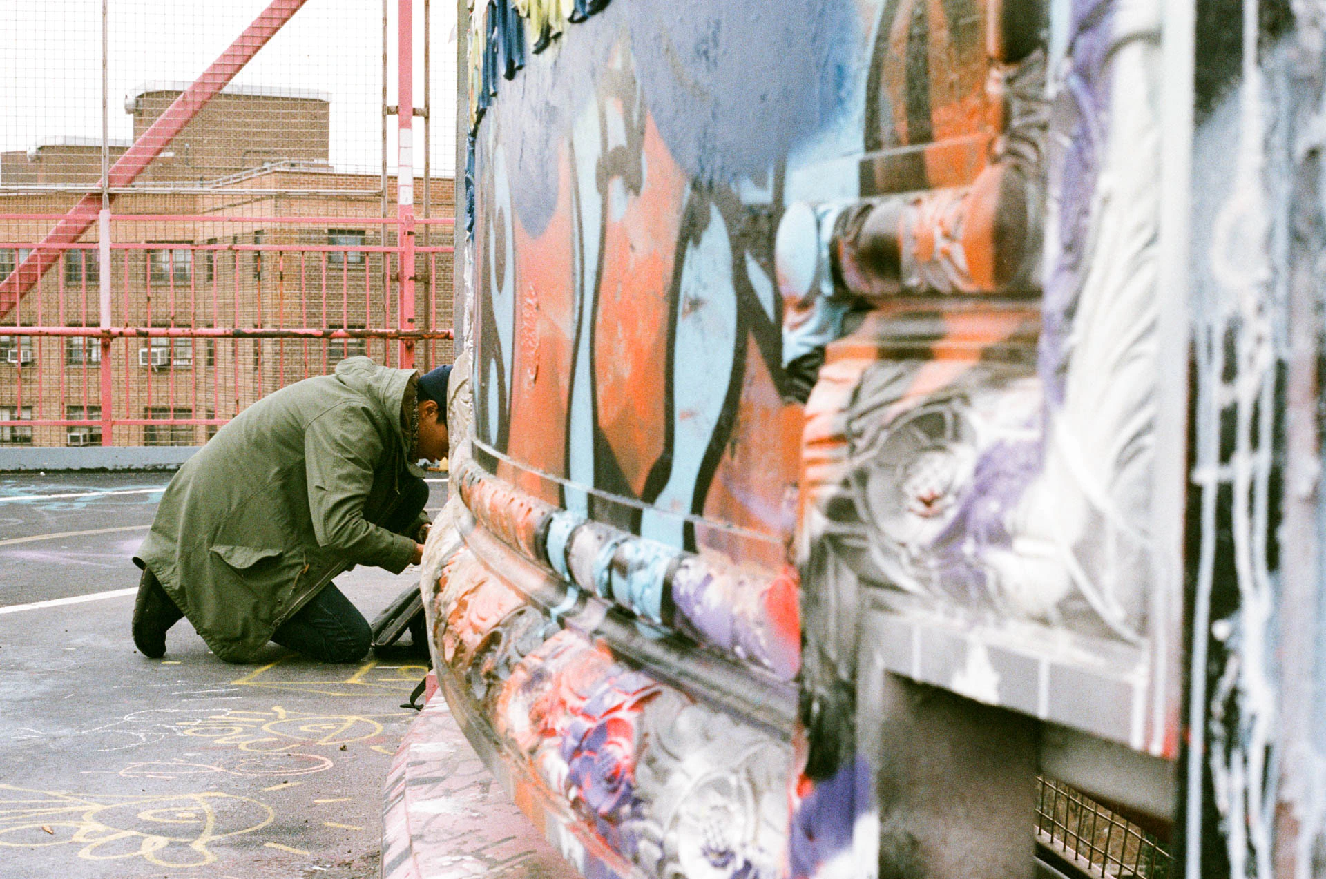 man photographing Williamsburg bridge on film