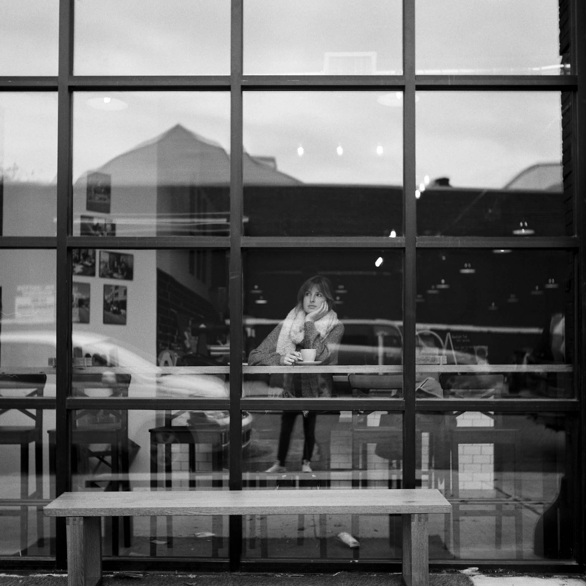 woman in cafe window on film