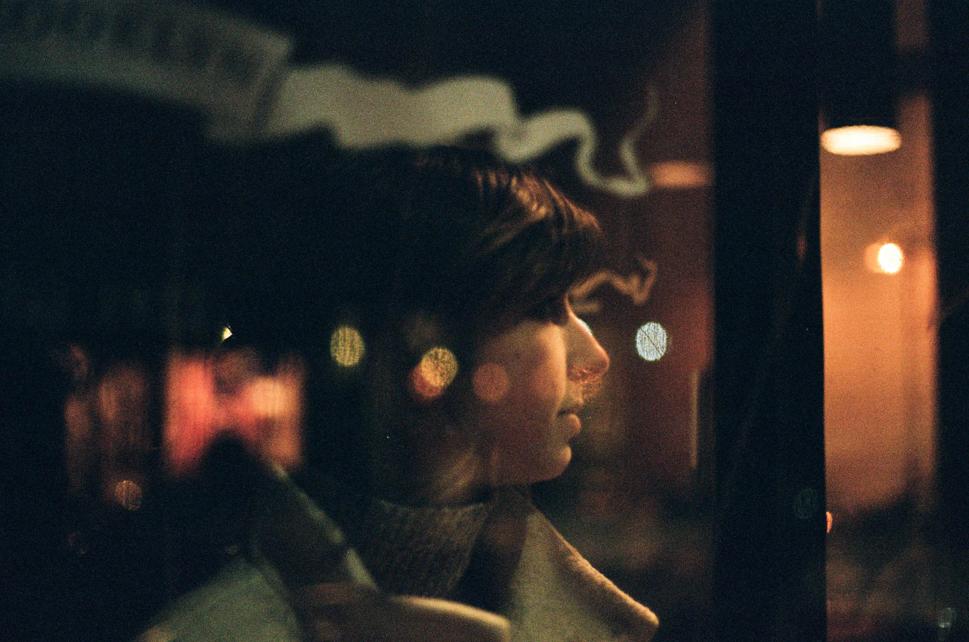 profile of a woman through door on film