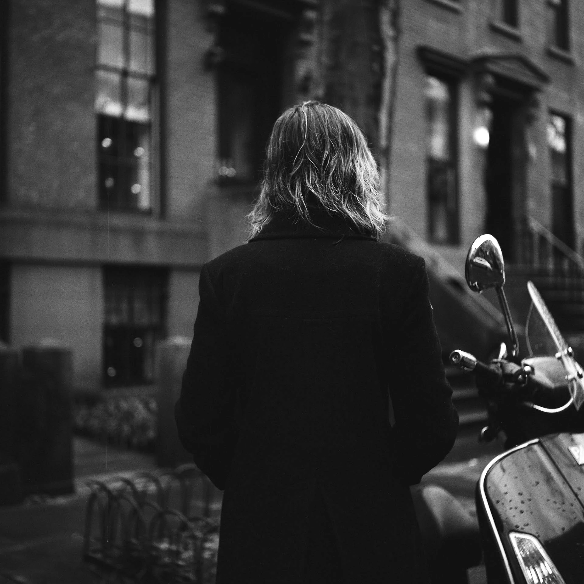 back of a woman on film in black and white