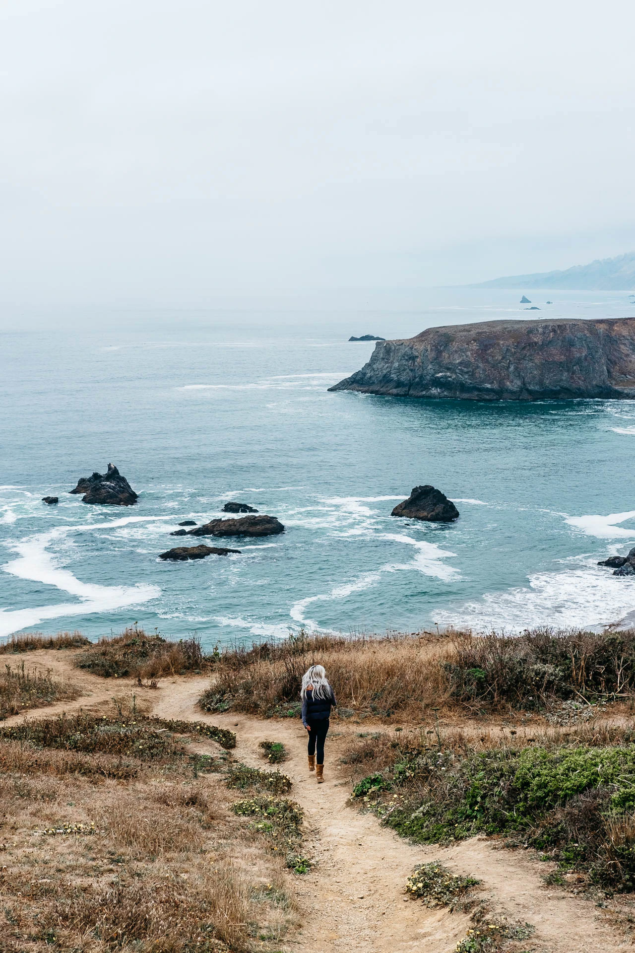 woman walking coast goat neck California