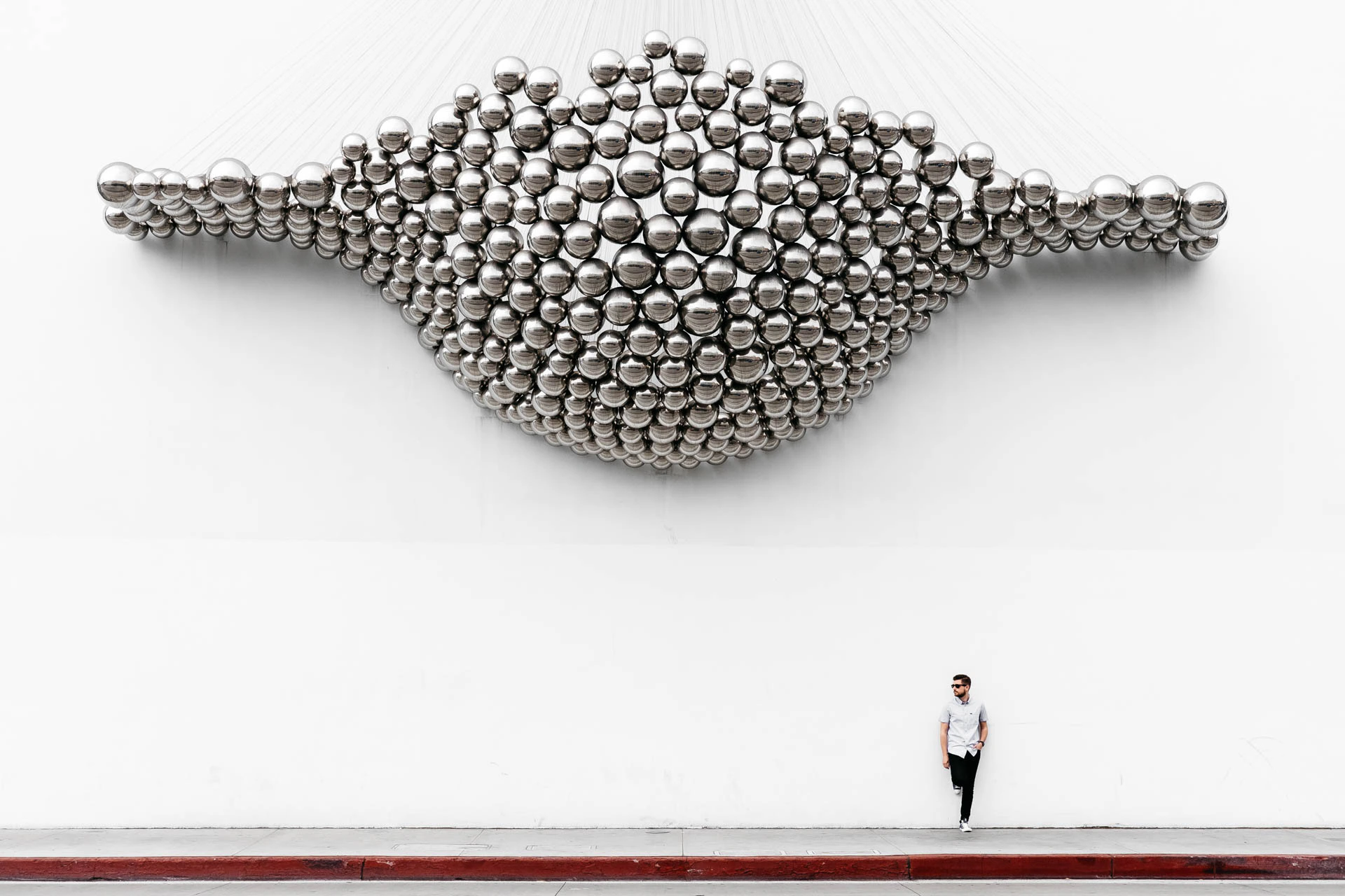 marble wall in los Angeles with man underneath it