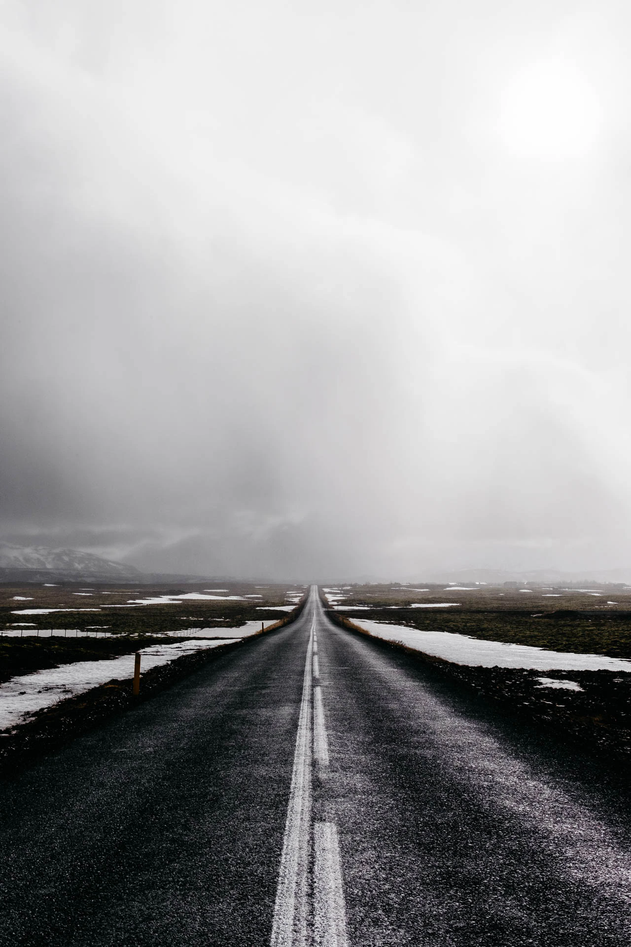 long road on stormy day in iceland