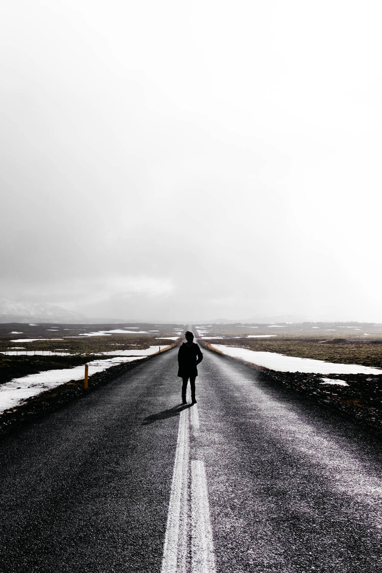 man in road in iceland