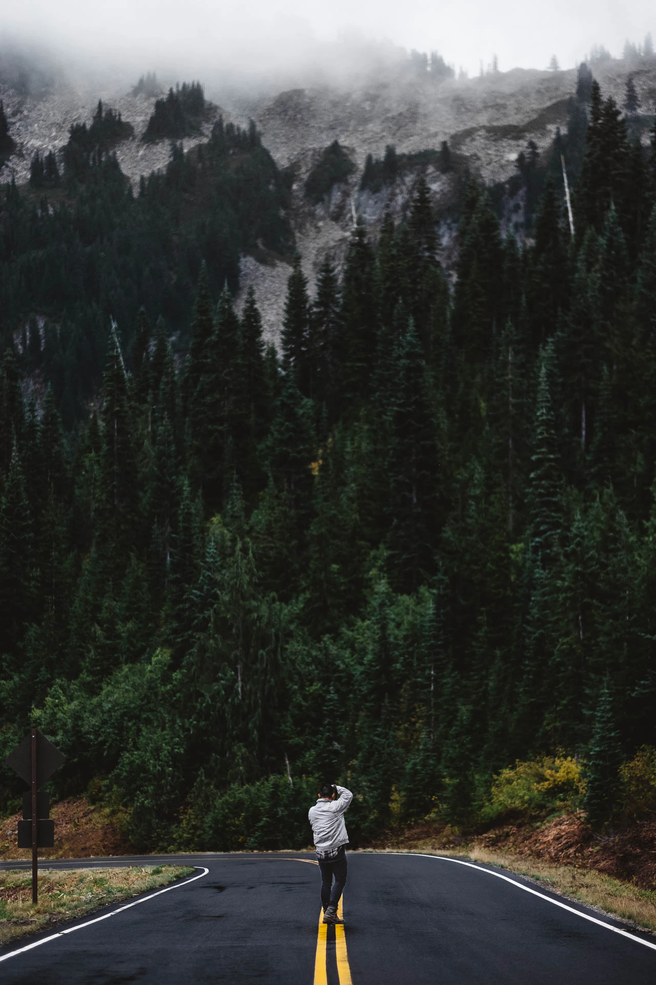 man walking on mount Rainer road