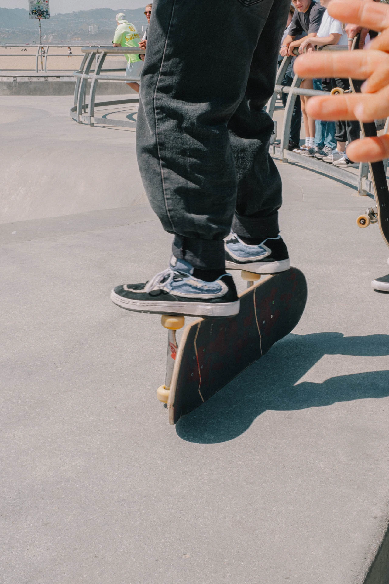 man balancing on skateboard trucks
