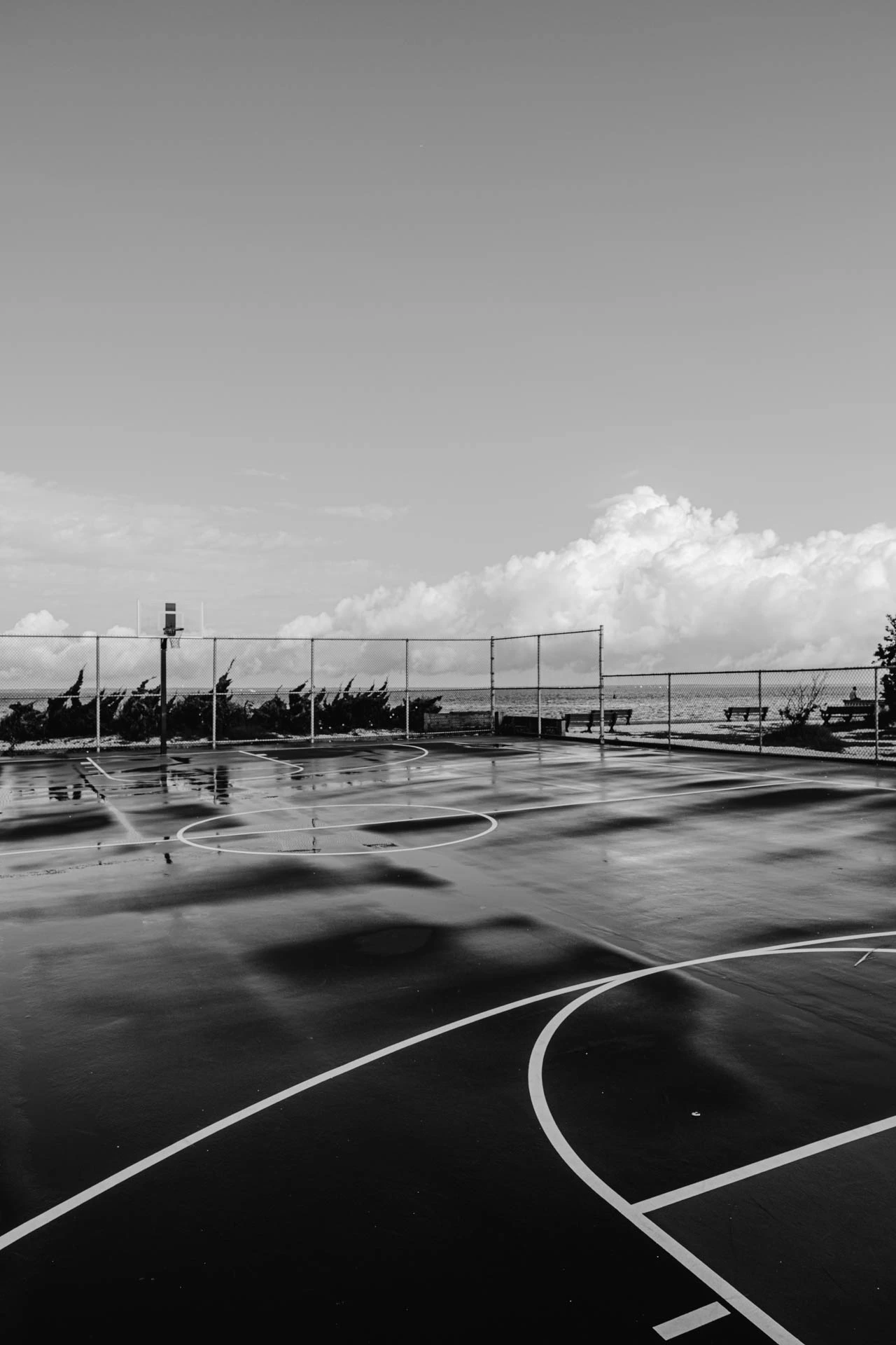 black and white basketball court after a storm