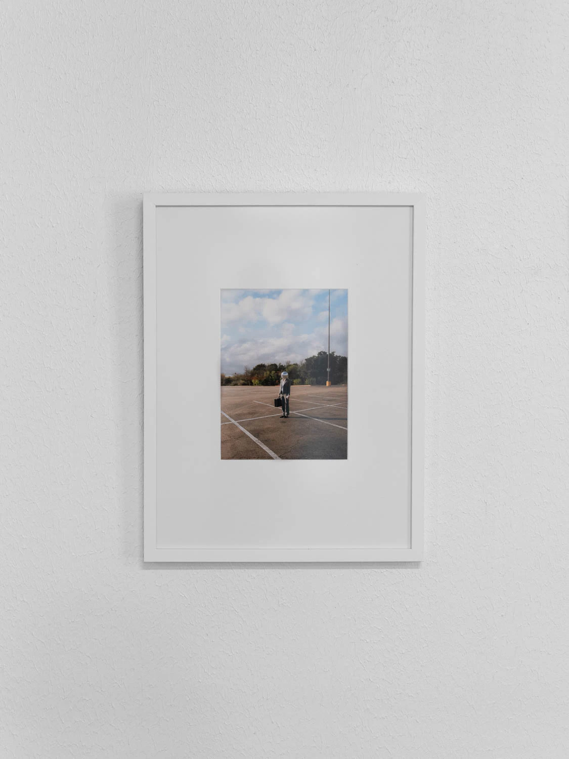 framed photo from happy hour series at sxsw 2025. Man with disco ball head in a parking lot