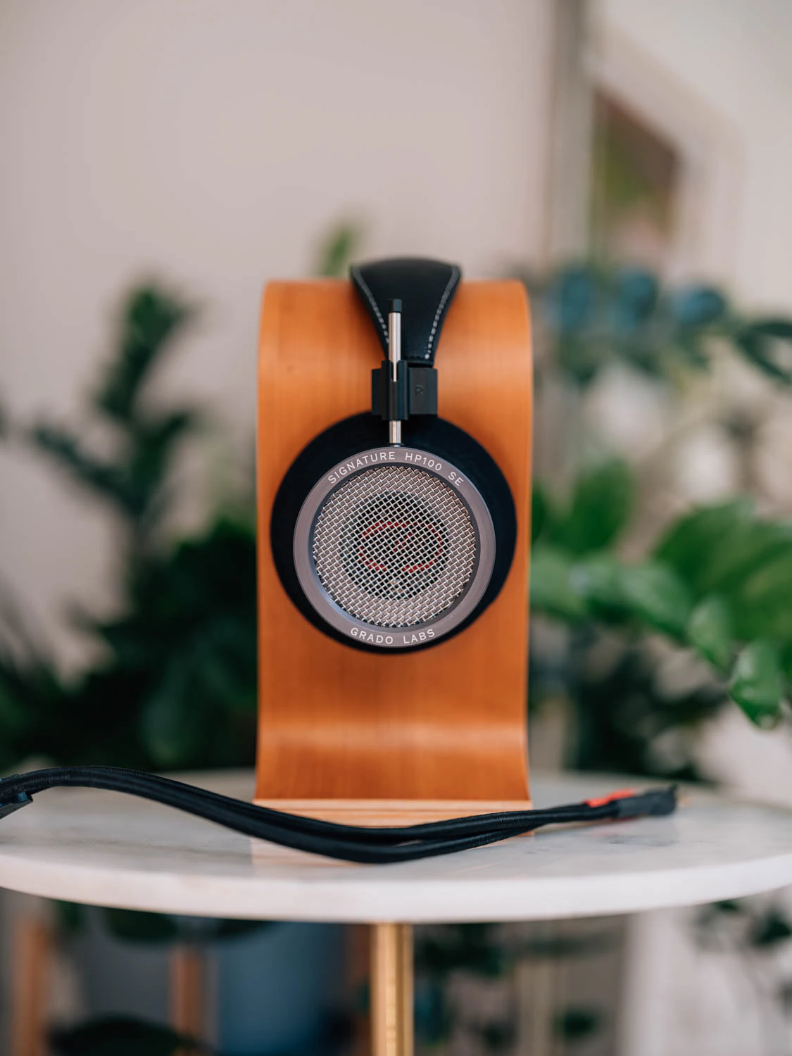 Grado HP100 SE headphones shot on Fujifilm gfx100s ii with plants and headphone stand