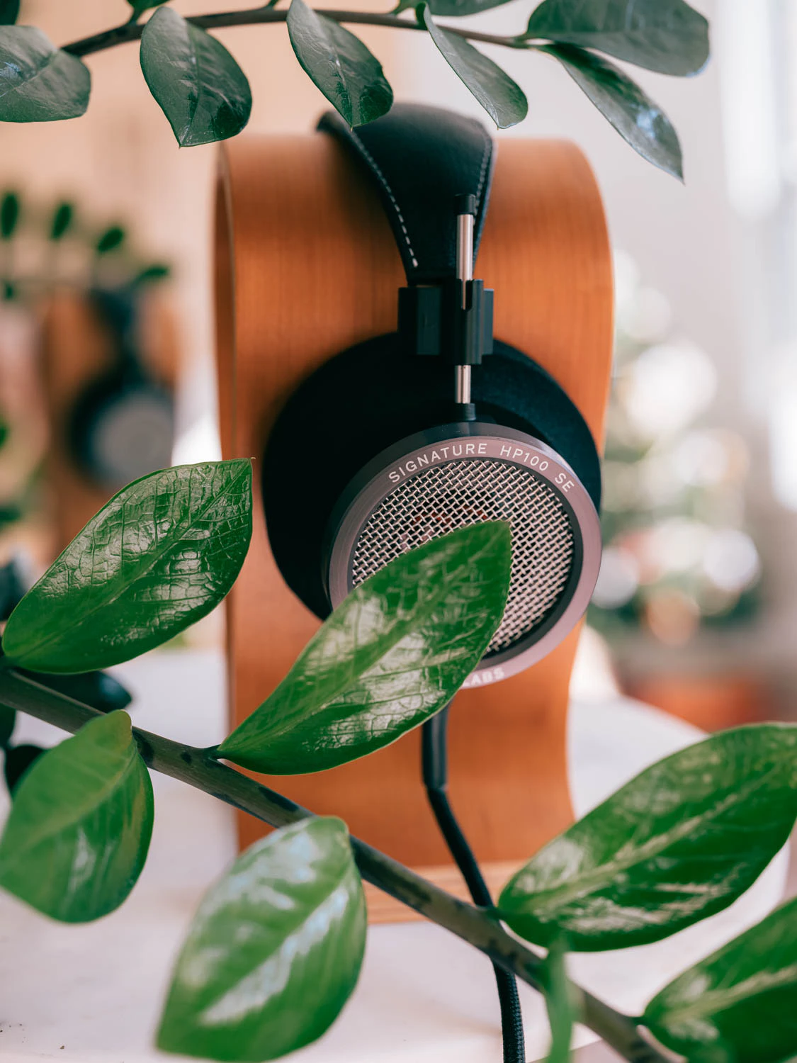 Grado HP100 SE headphones shot on Fujifilm gfx100s ii with plants and headphone stand