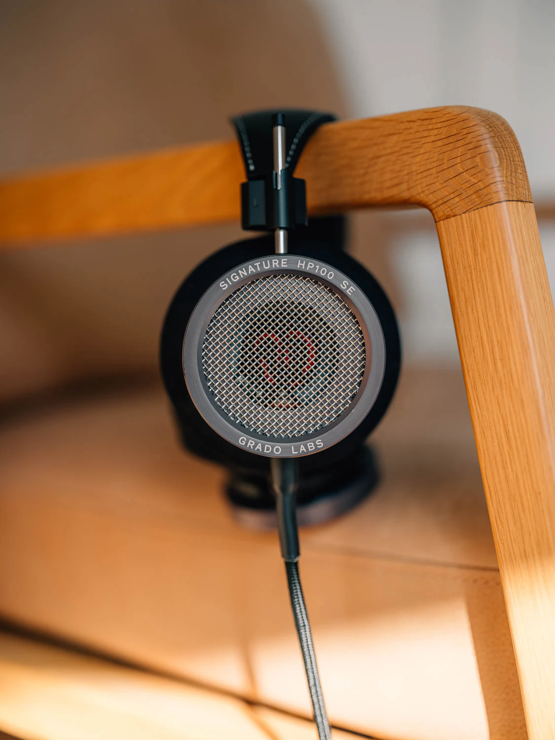 Grado HP100 SE headphones shot on Fujifilm gfx100s ii on wood and leather chair