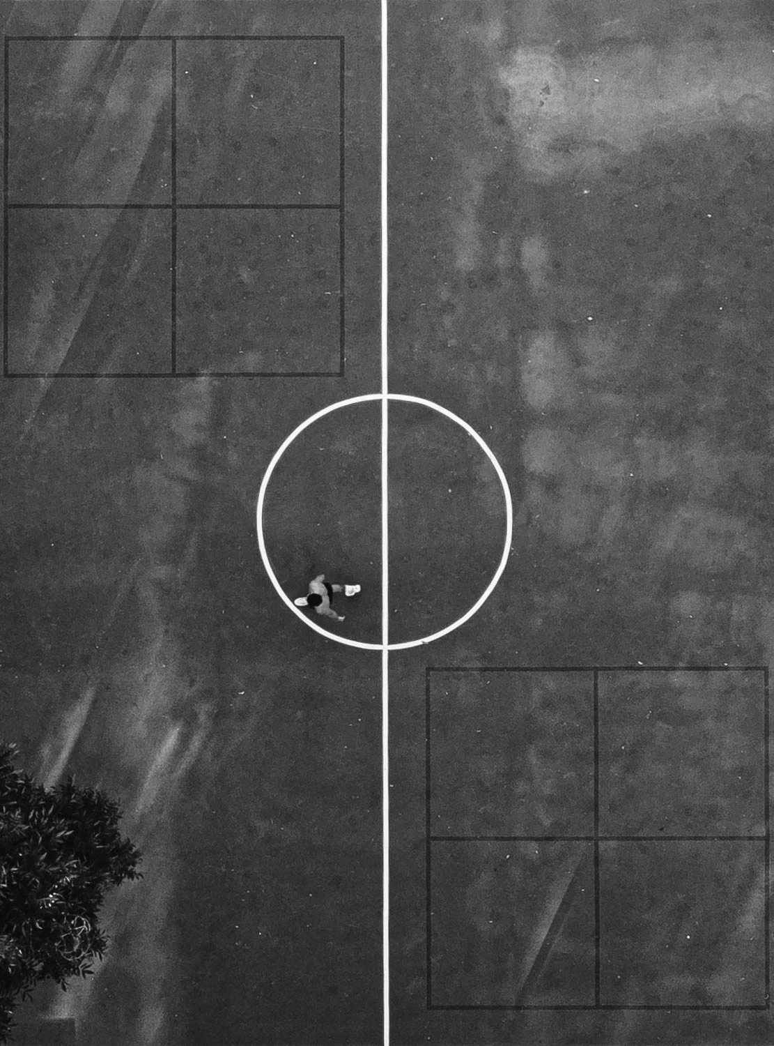 Austin basketball court and players from above in black and white
