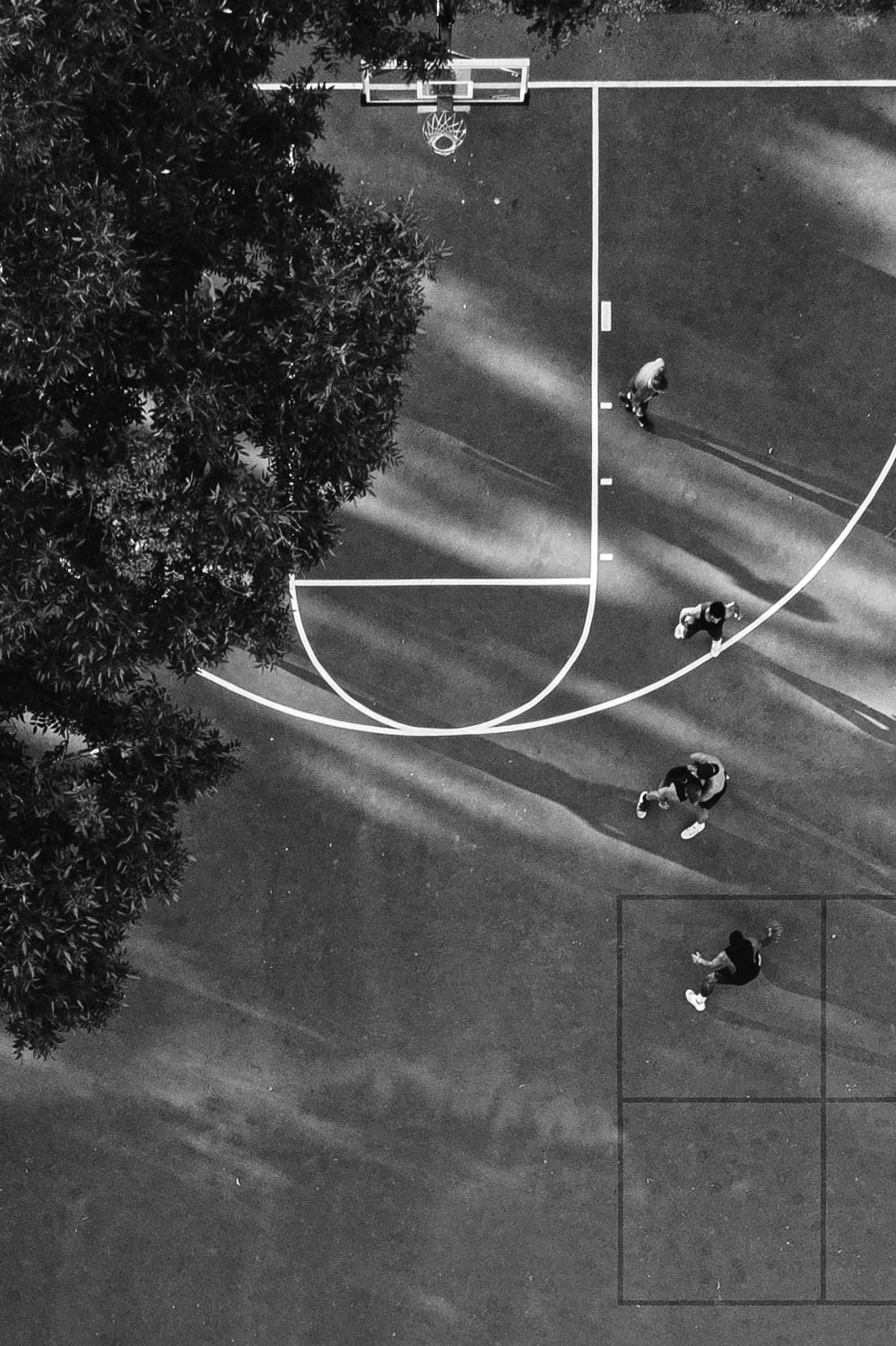 Austin basketball court and players from above in black and white