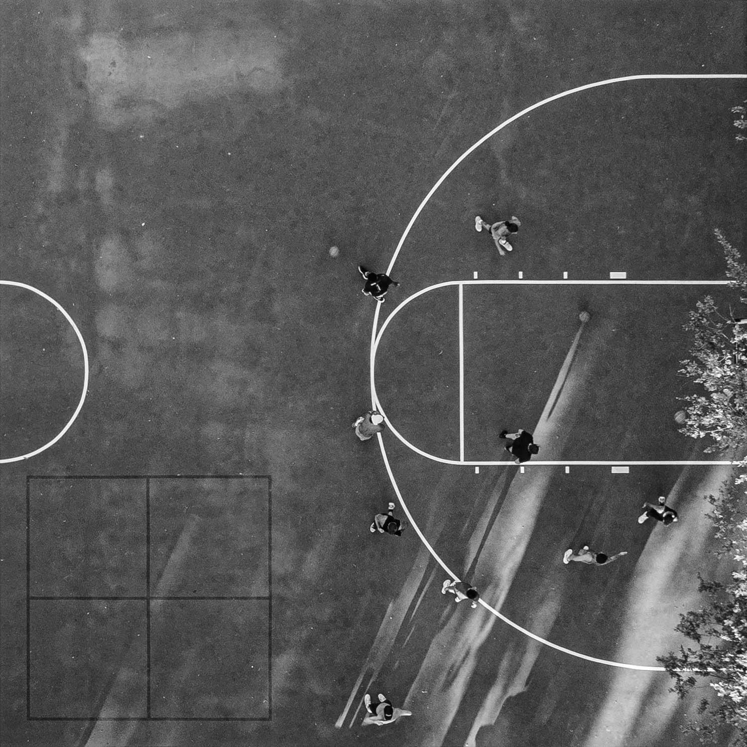 Austin basketball court and players from above in black and white