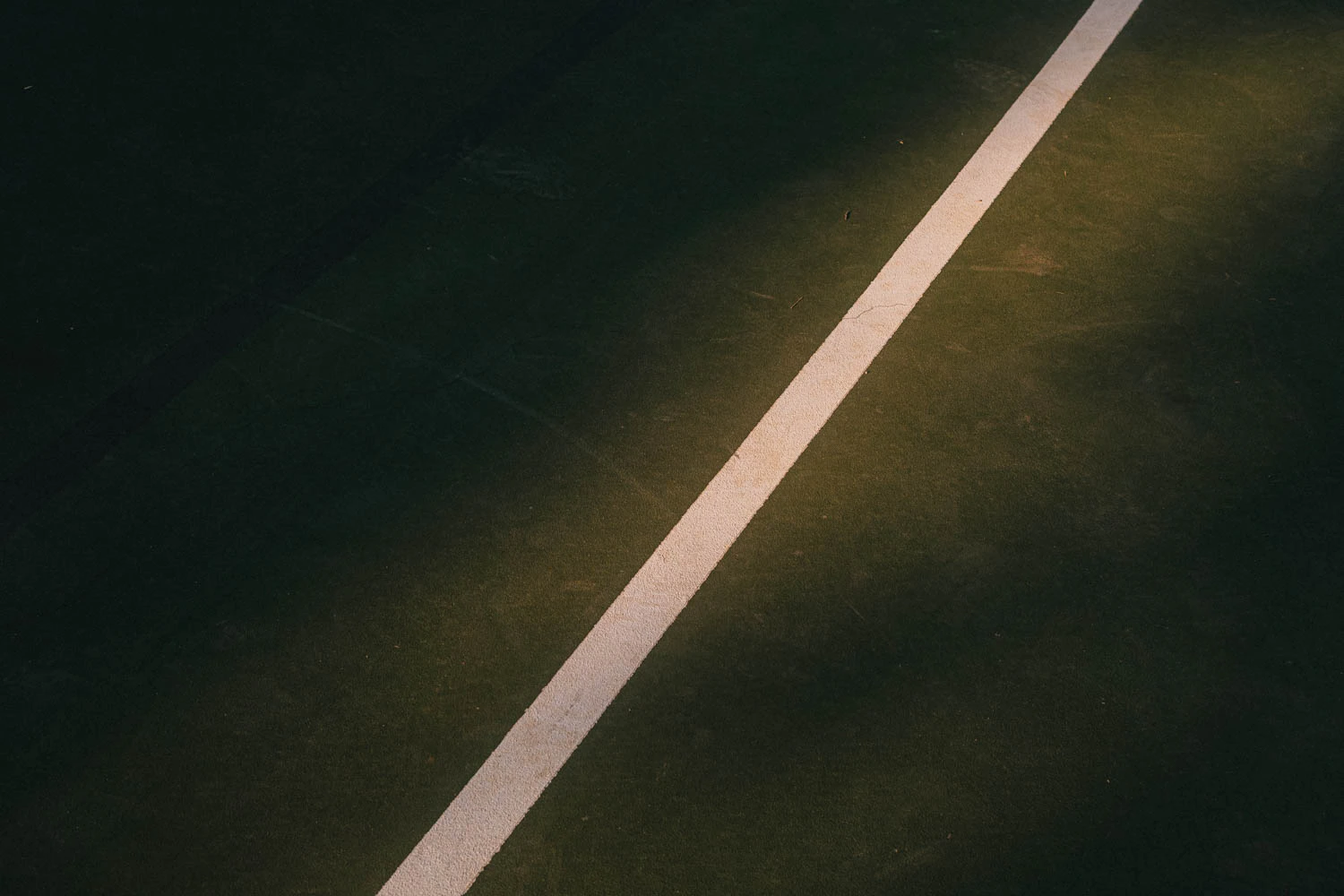 abstract green and red basketball court lines at sunset