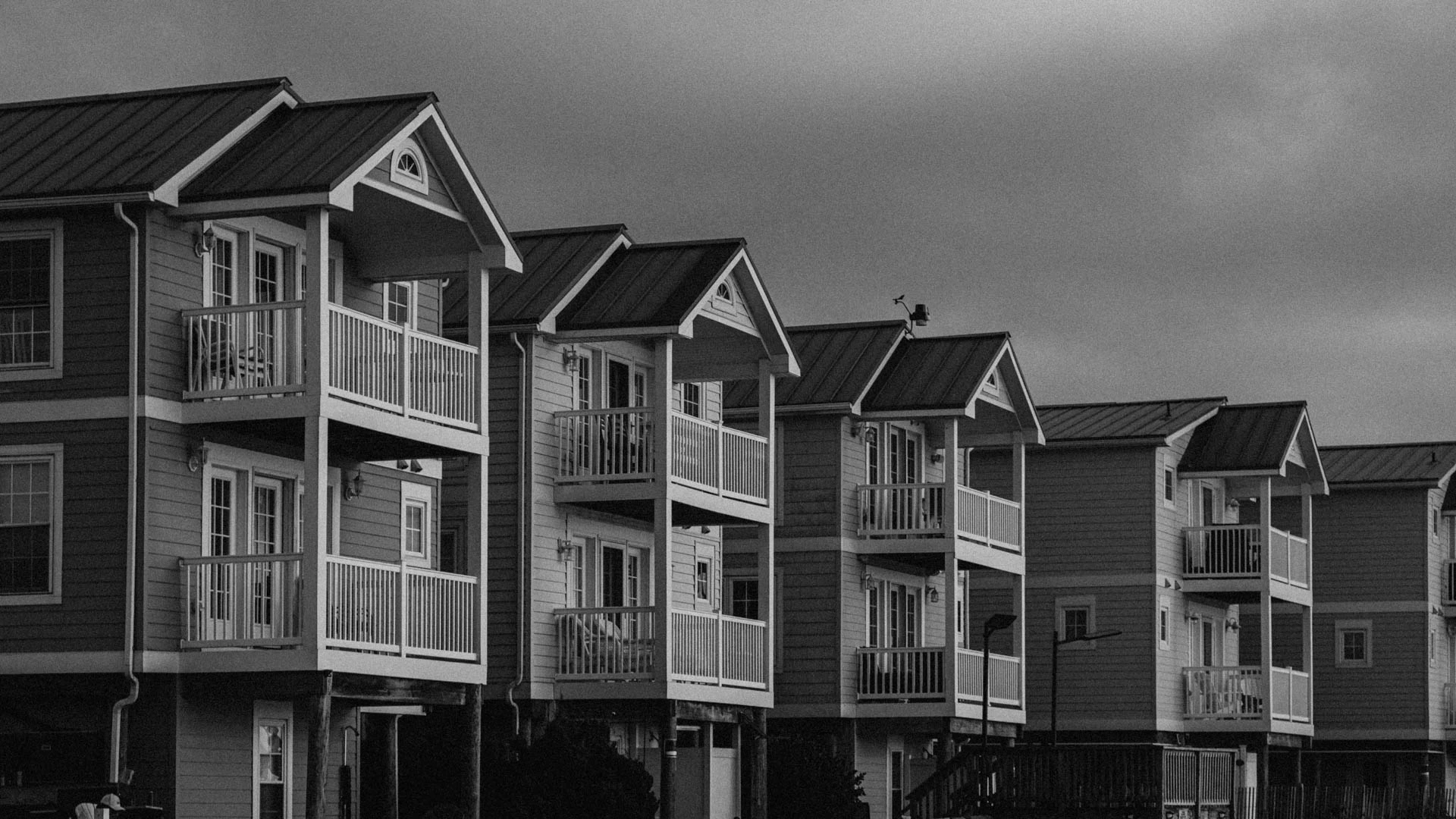 identical houses in a row on the bay in black and white