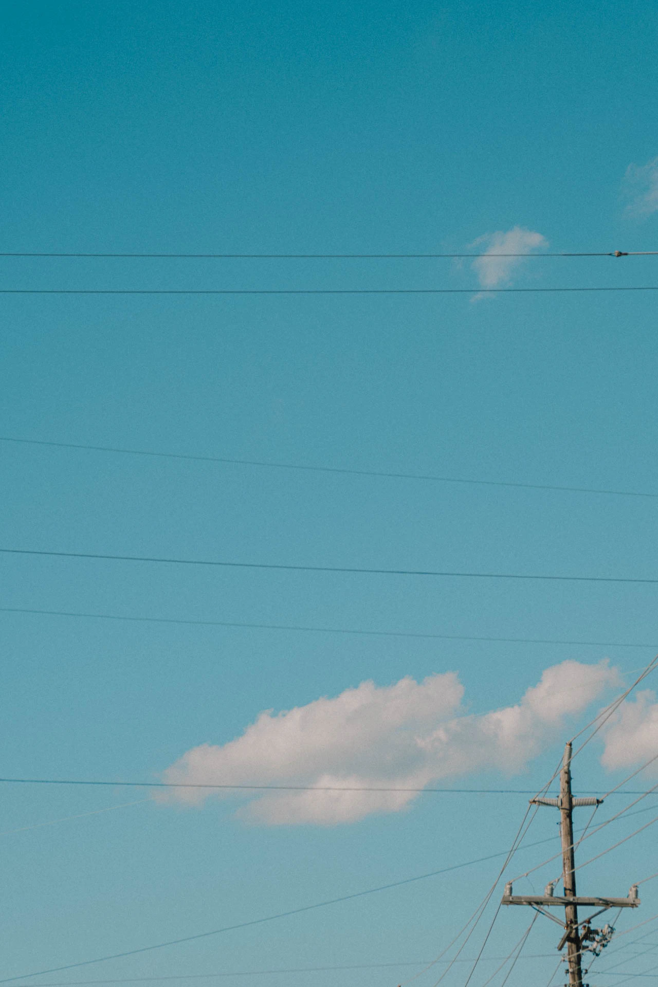 clouds over a telephone poll in beach haven