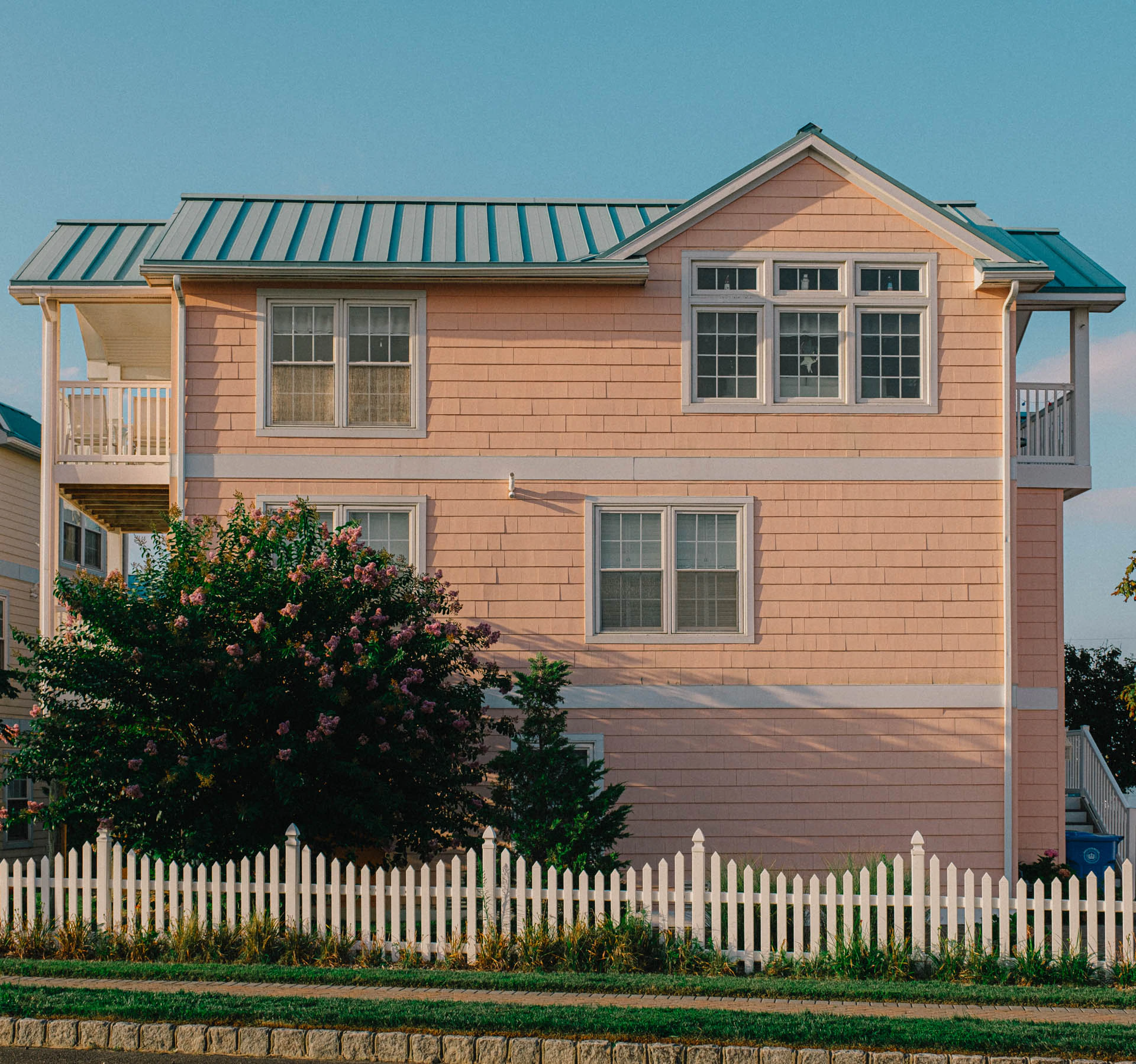 pink house at sunset by the bay in long beach island