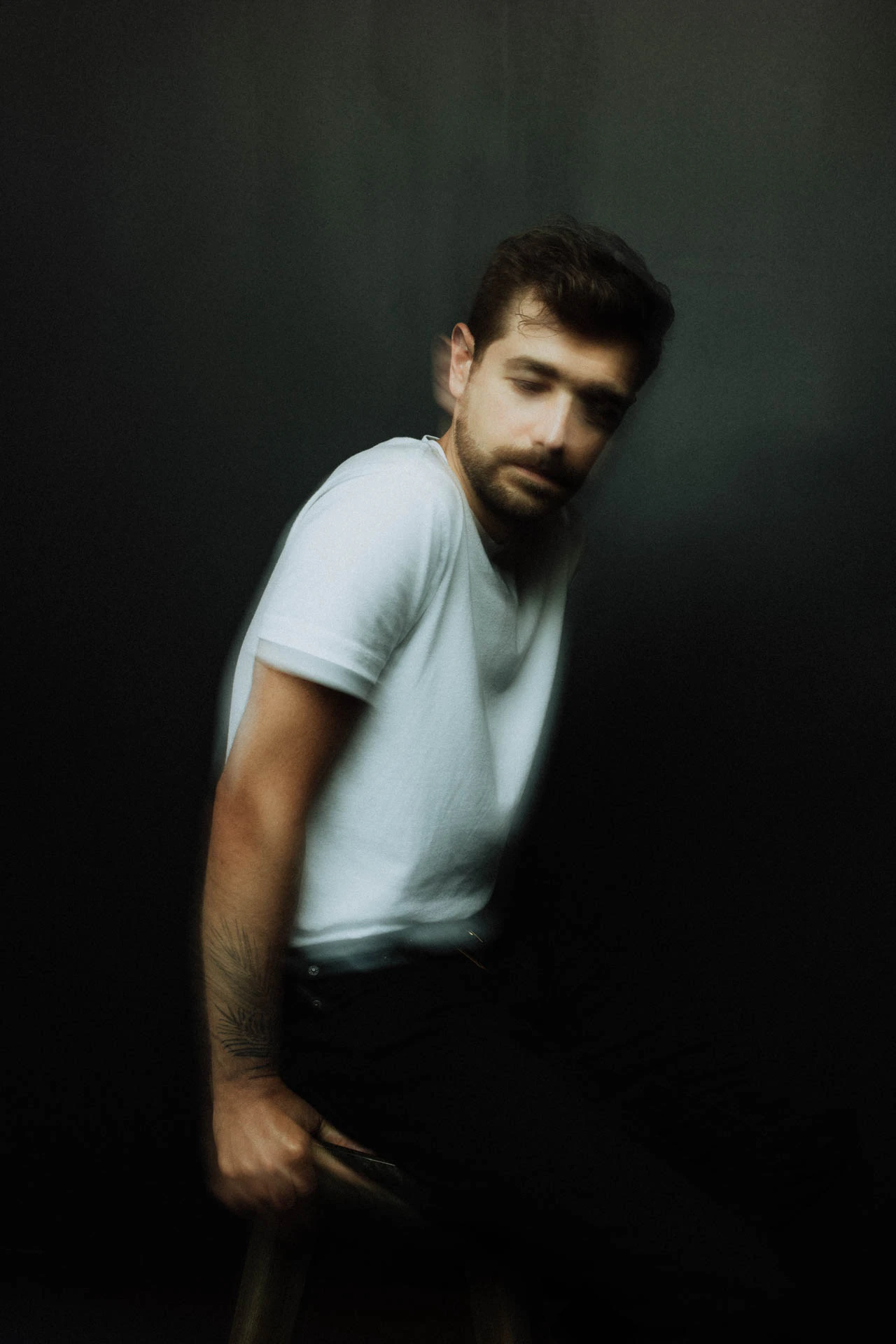 Jonathan Grado in a white shirt in studio with motion