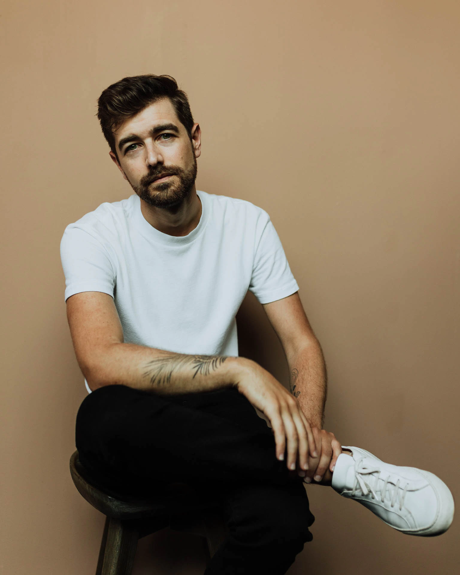 Jonathan Grado sitting in a white shirt
