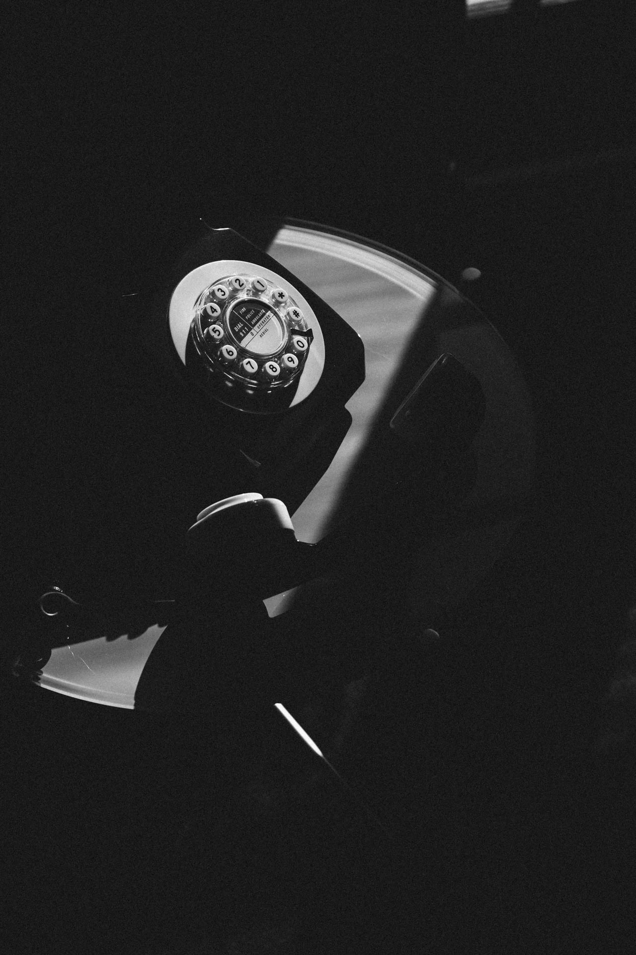 black and white rotary phone in Santa monica hotel during sunset