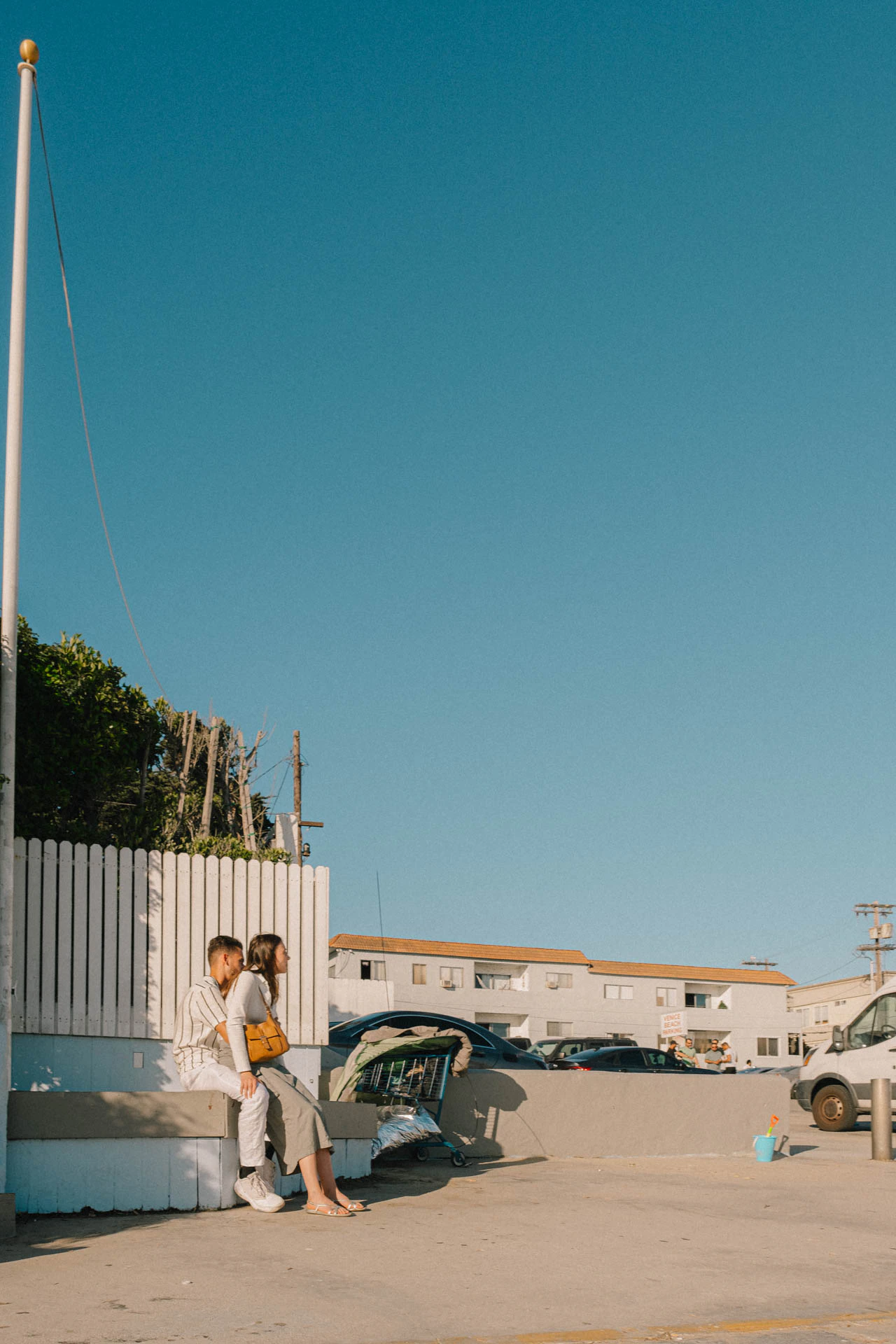 a couple waiting for dinner on Venice Beach