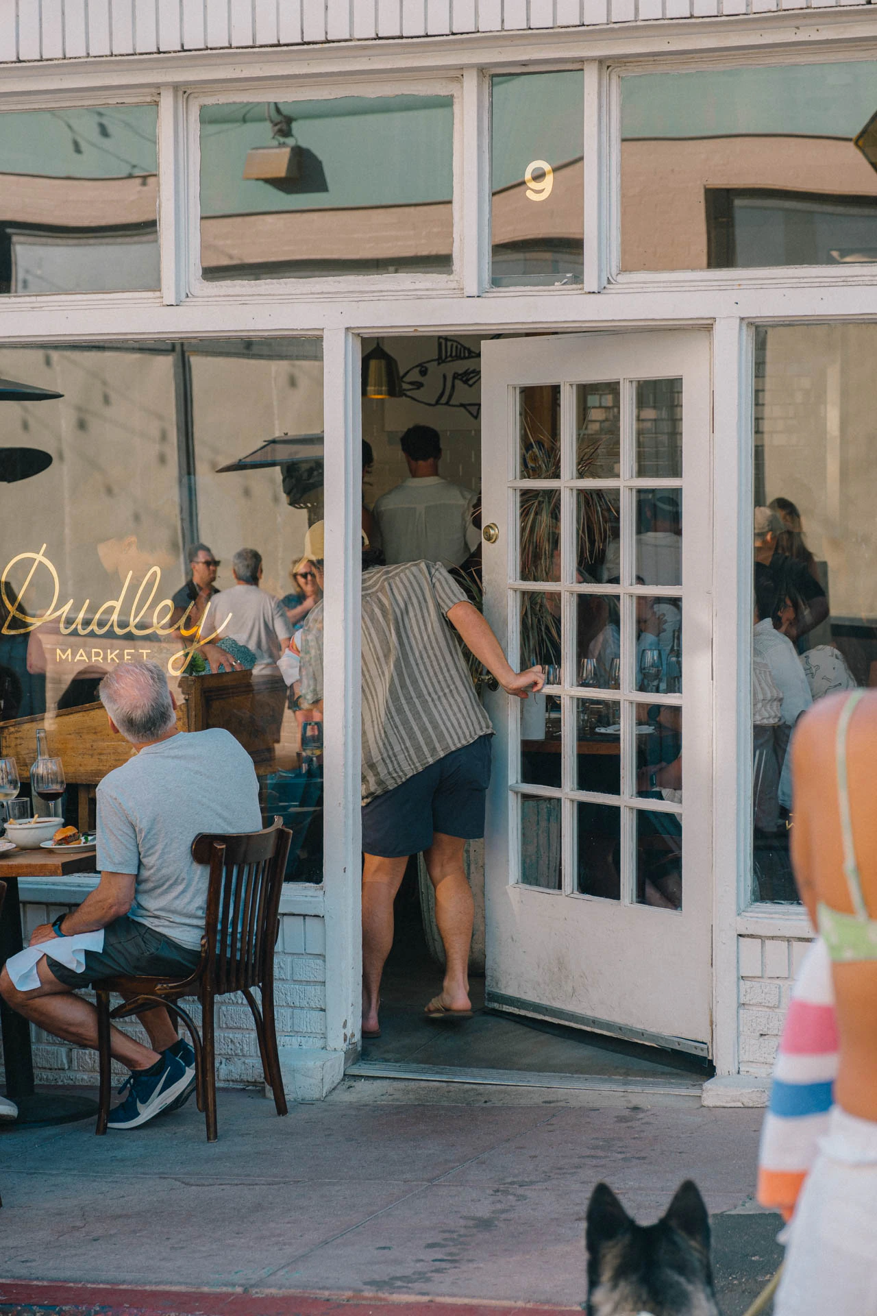 man walking into Dudley Market in Venice Beach
