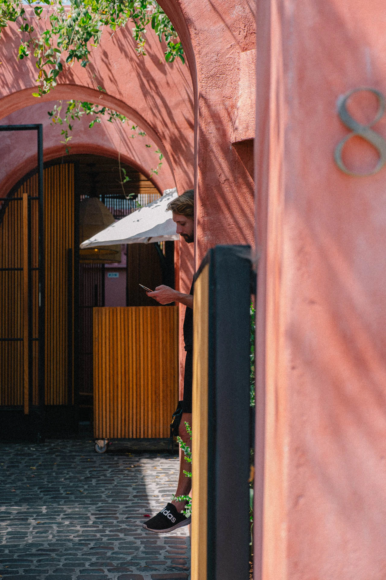 pink walled entrance of Great white cafe