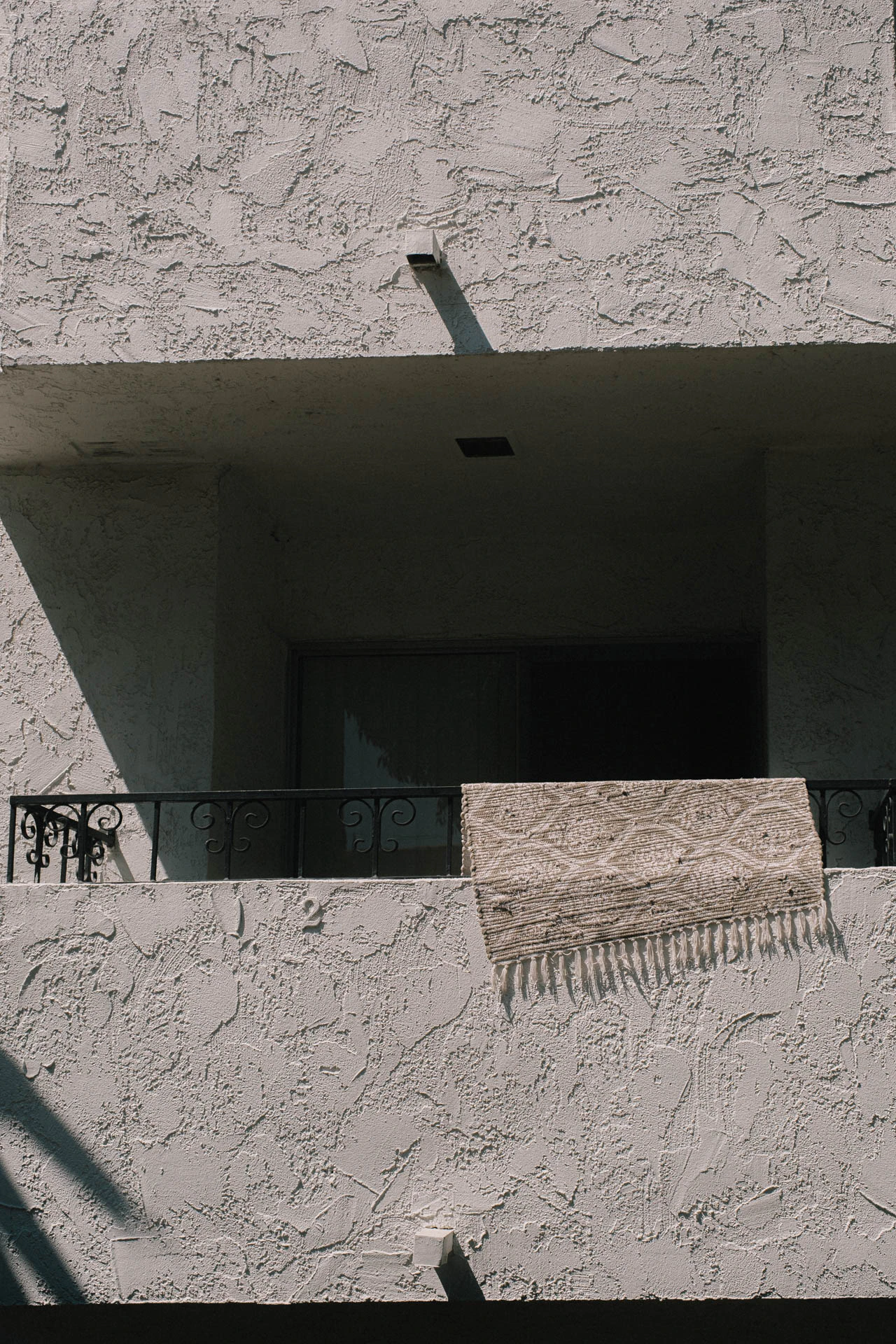 a carpet draped over a balcony in Santa Monica