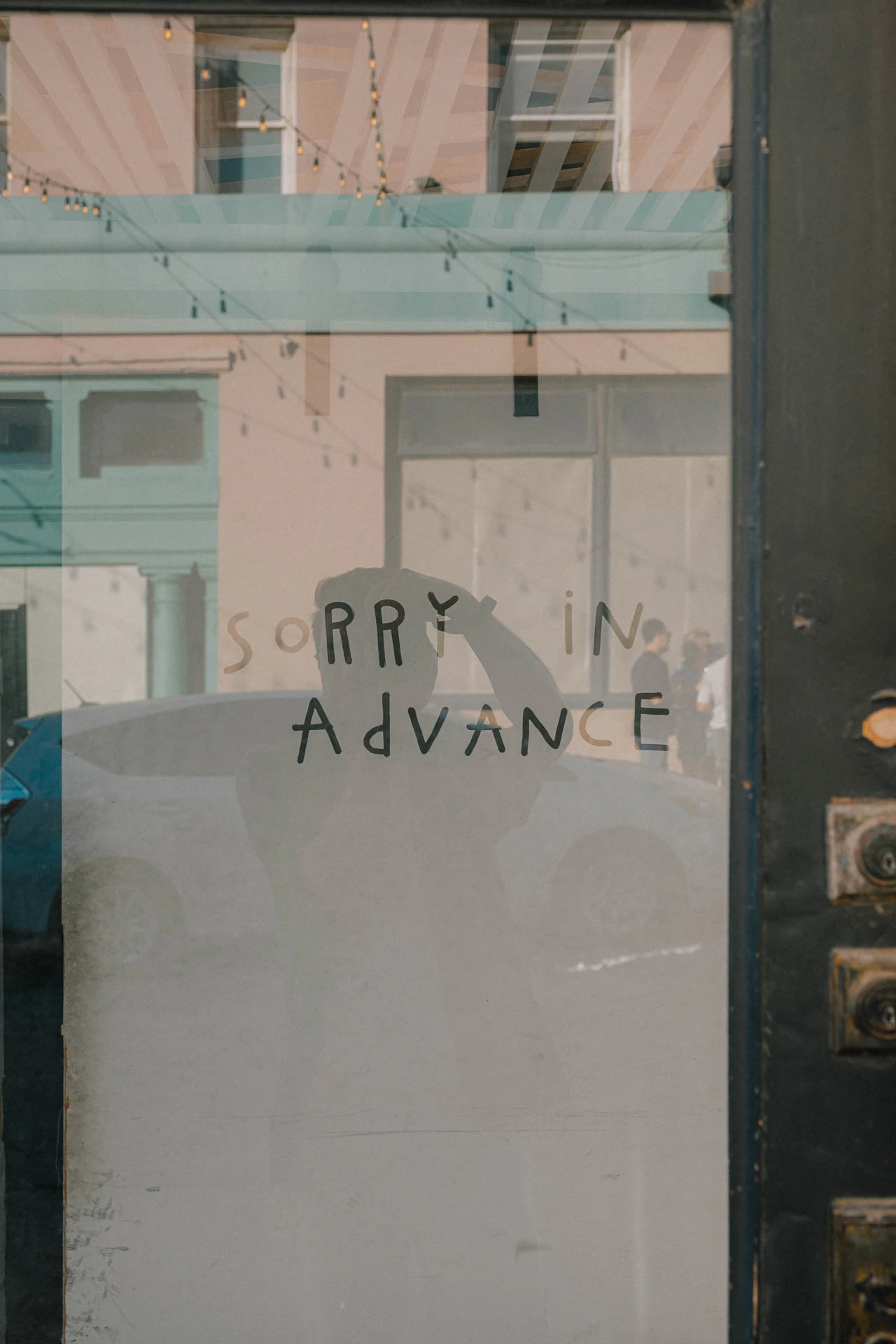 a sign reading sorry in advanced in Venice Beach