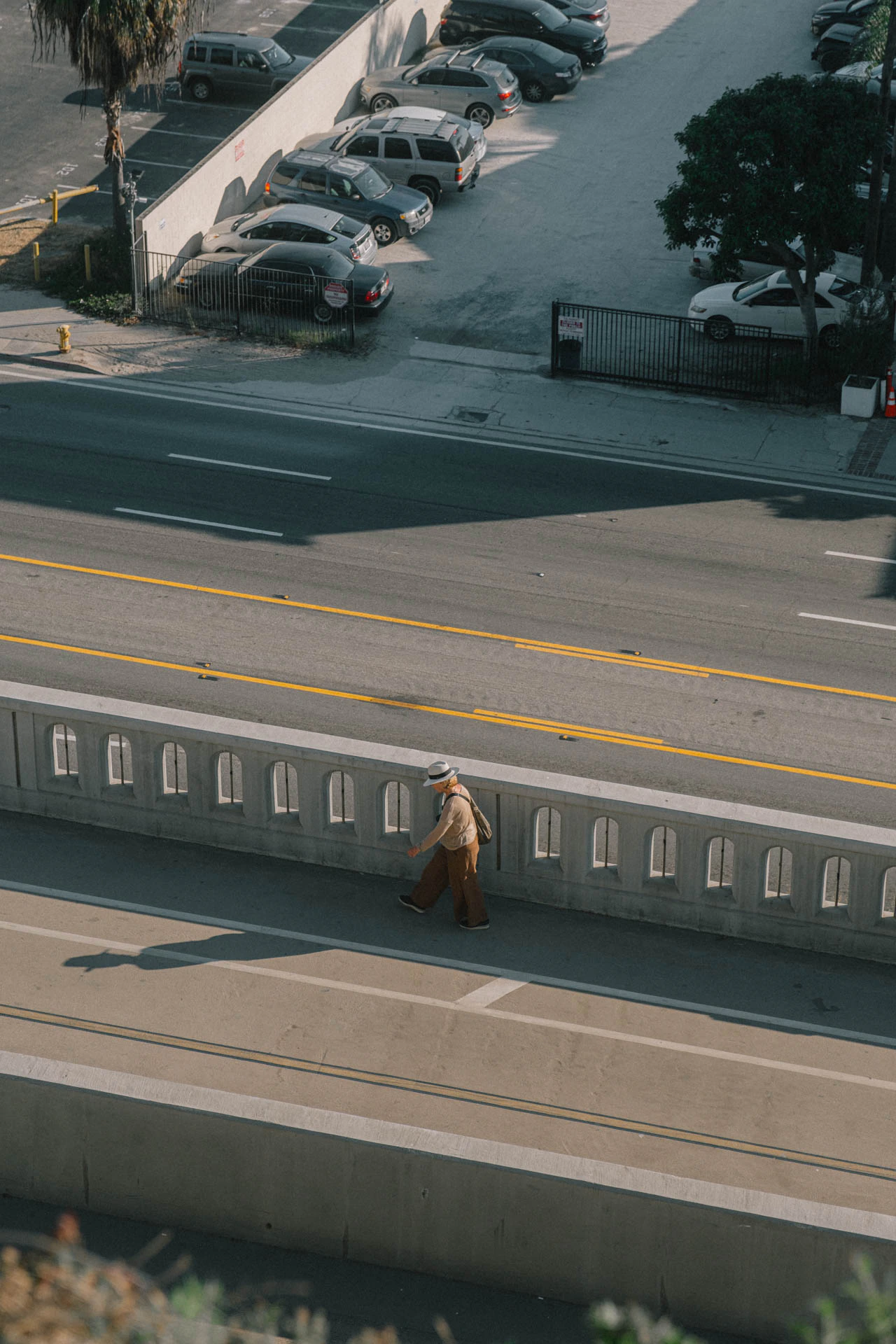 woman walking the pacific coast highway at sunset