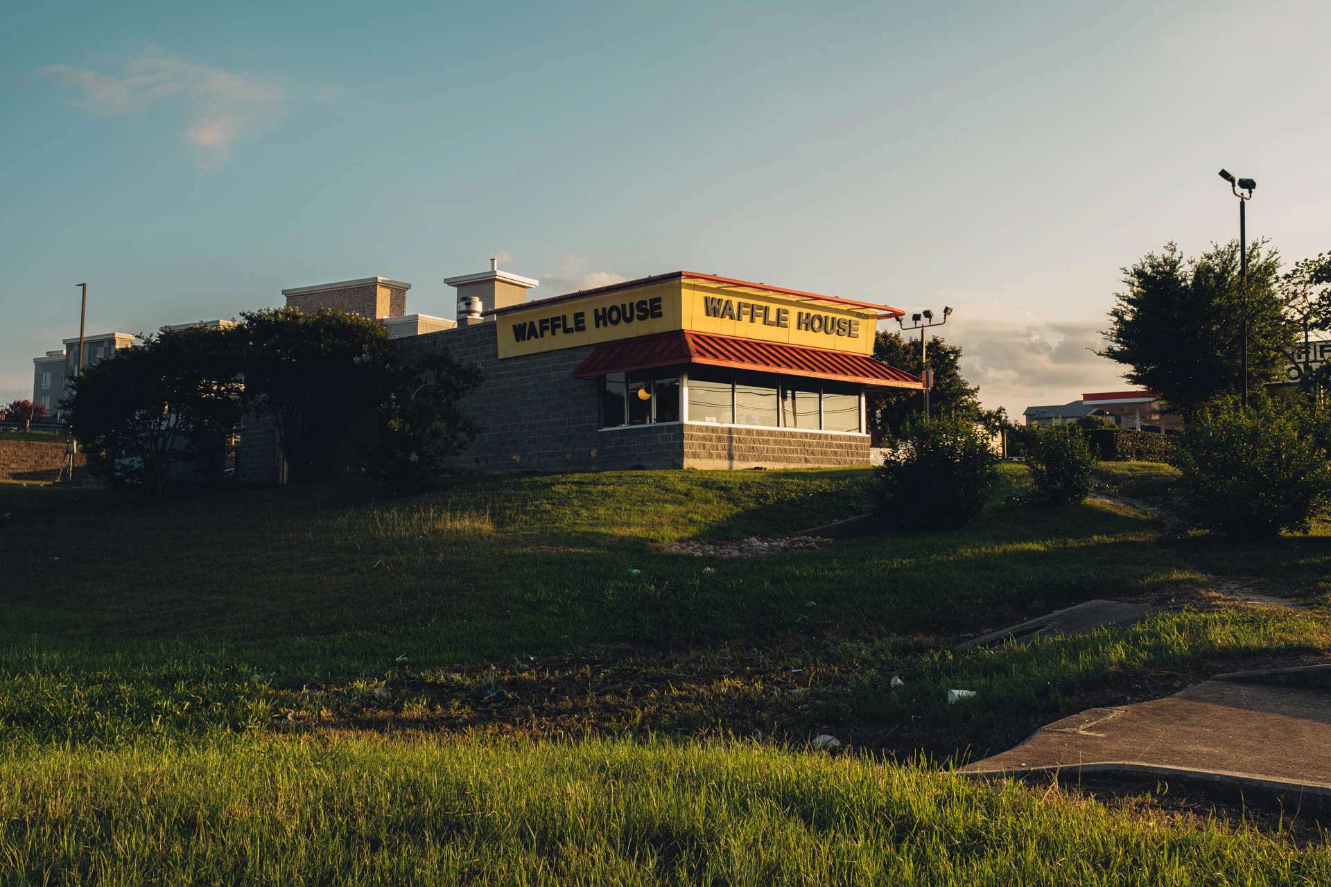 Waffle House at Sunset on a grassy hill in Texas