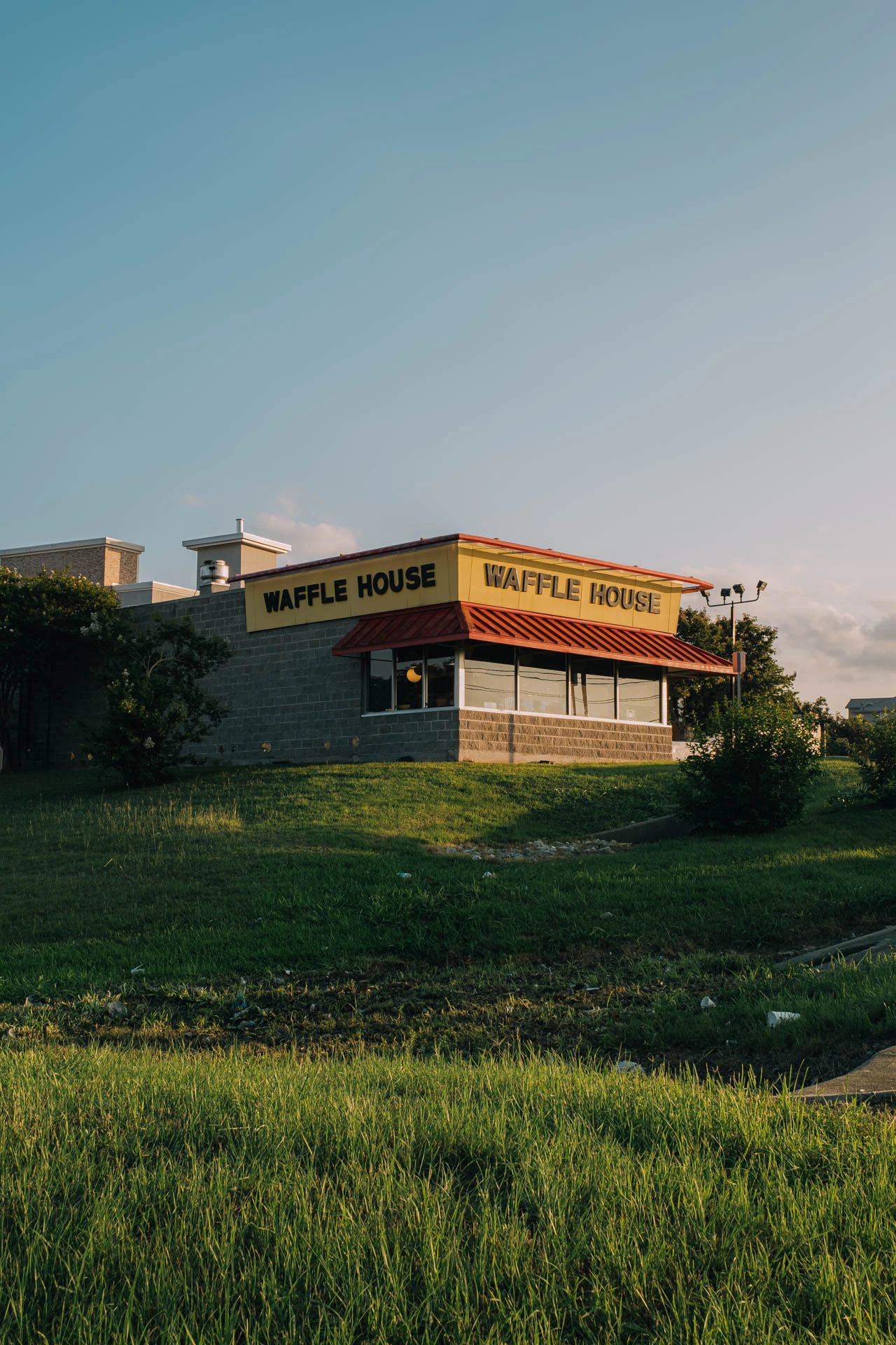 Waffle House at Sunset on a grassy hill in Texas