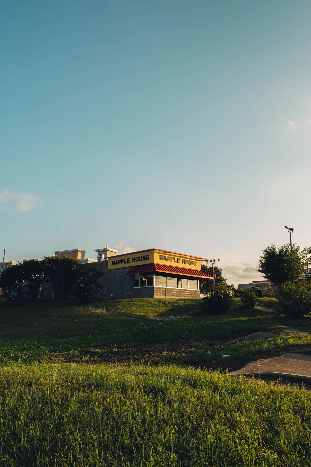 Waffle House at Sunset on a grassy hill in Texas