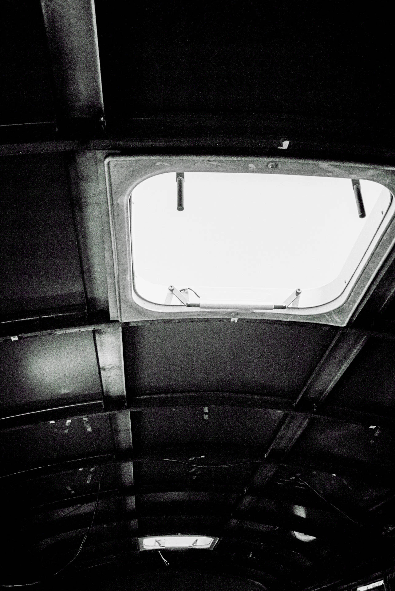 emergency door of an old school bus on black and white film in San Marcos