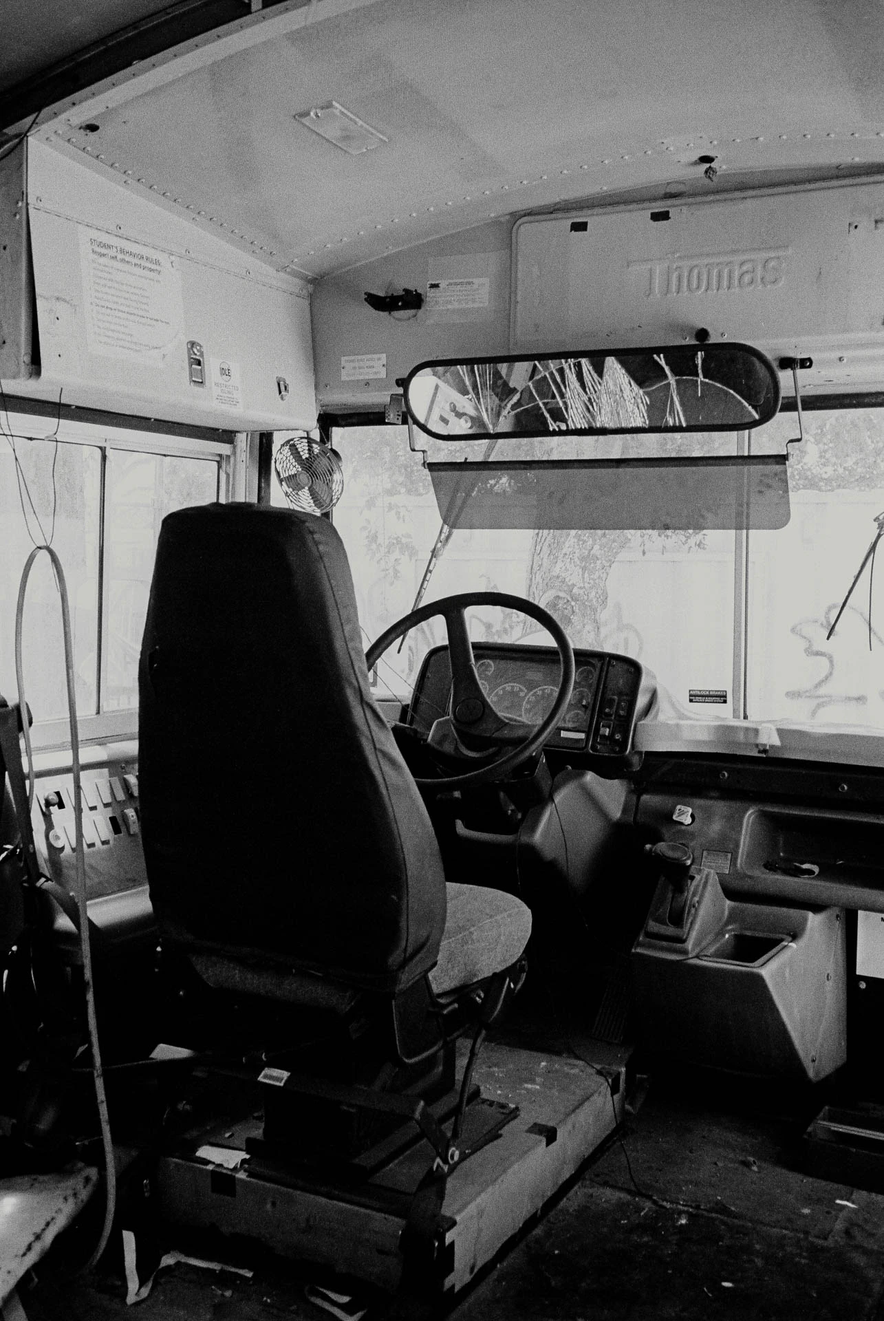 inside an old school bus on black and white film in San Marcos