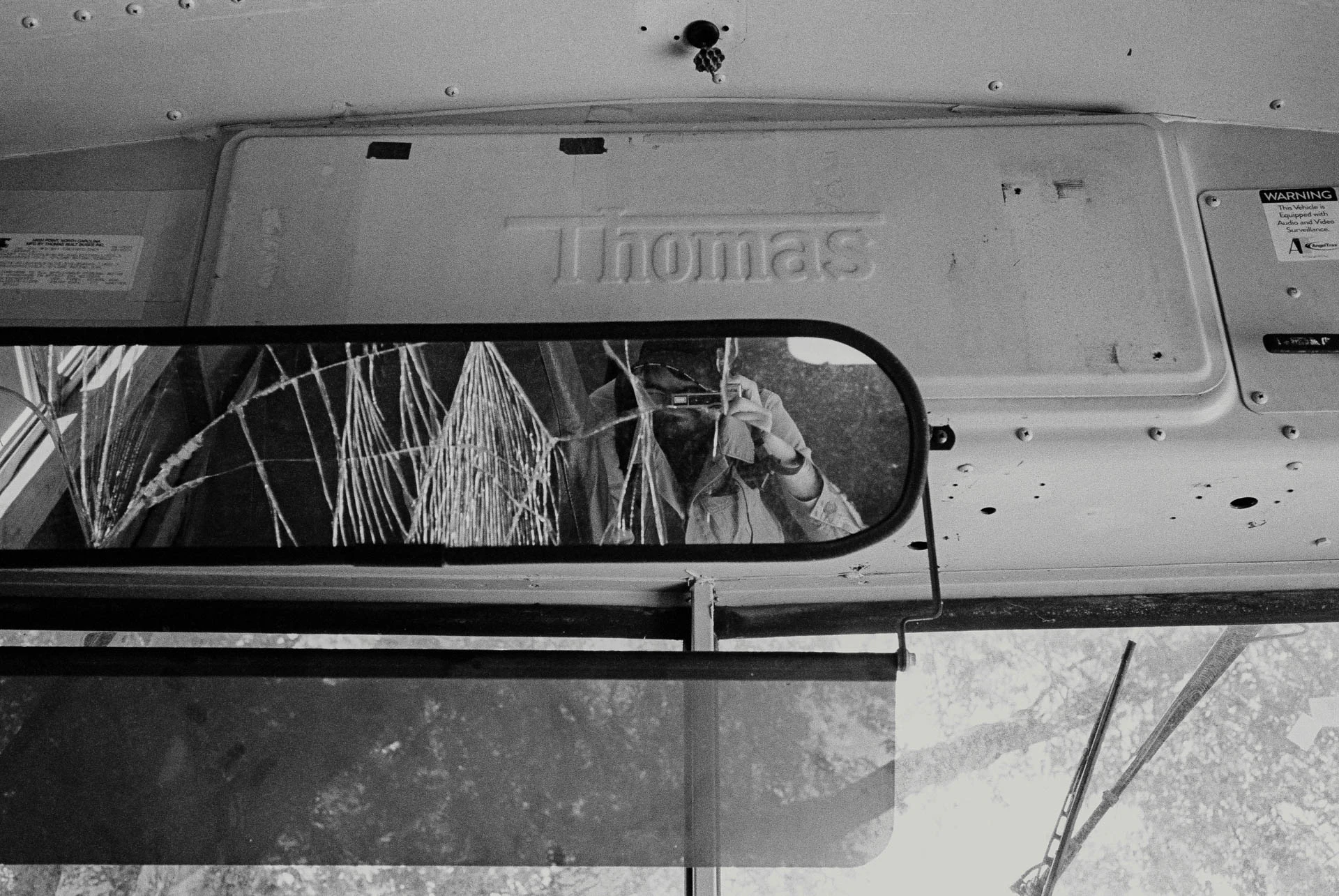 inside an old school bus on black and white film in San Marcos