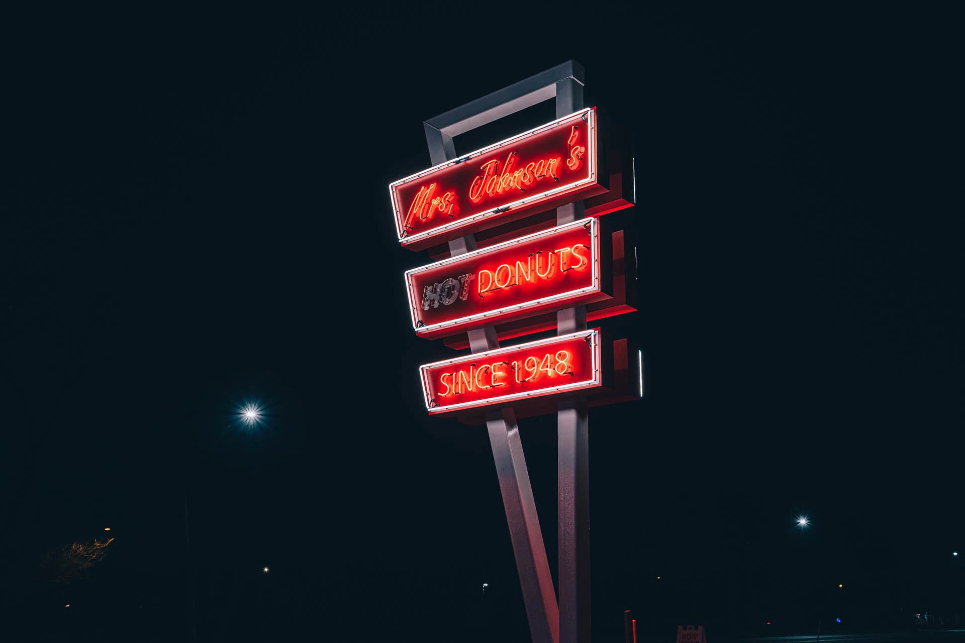 mrs Johnsons hot donuts neon sign in Austin Texas at night