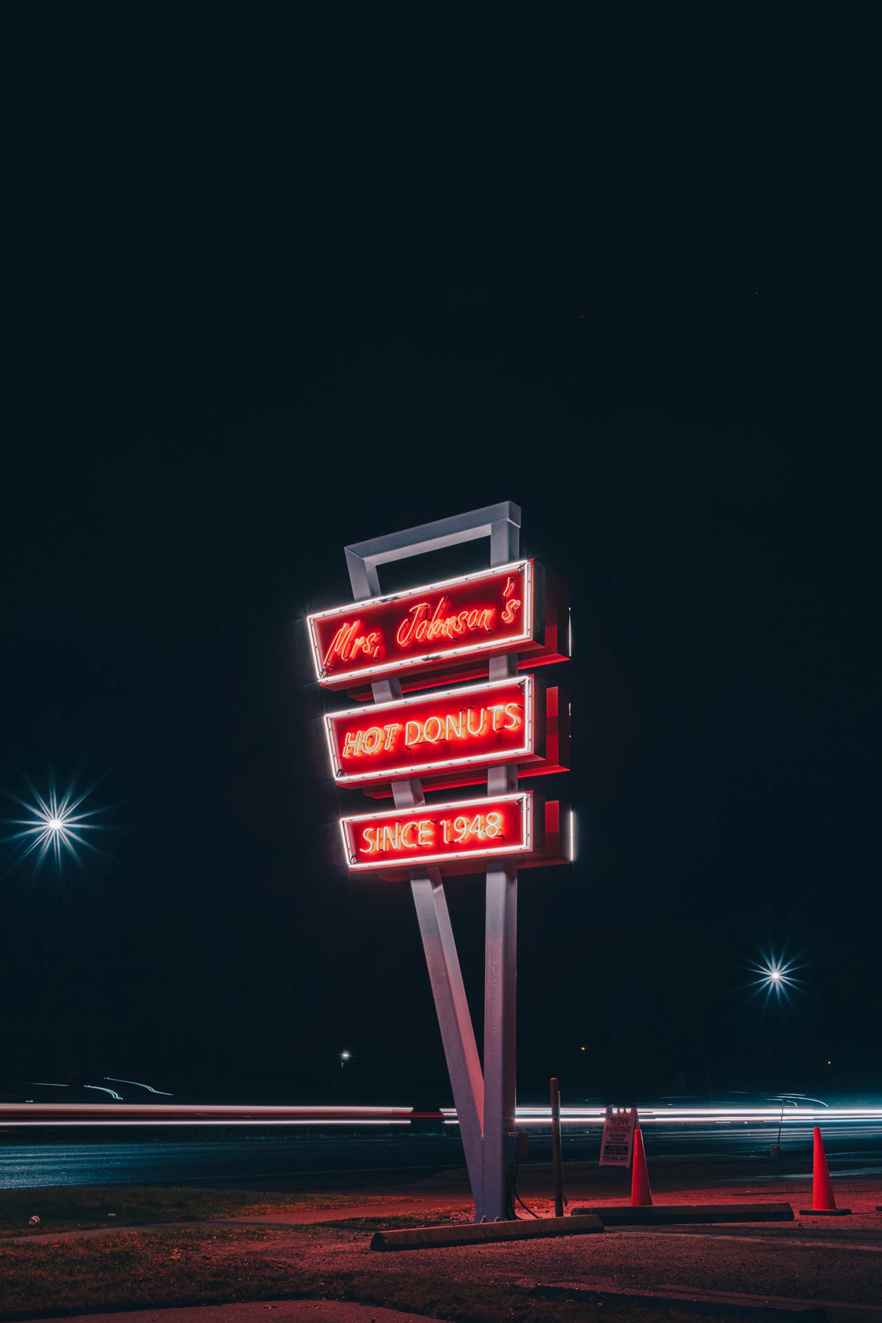 mrs Johnsons hot donuts neon sign in Austin Texas at night