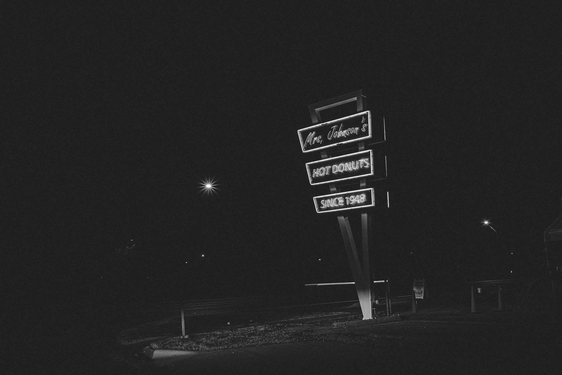 mrs Johnsons hot donuts neon sign in Austin Texas at night