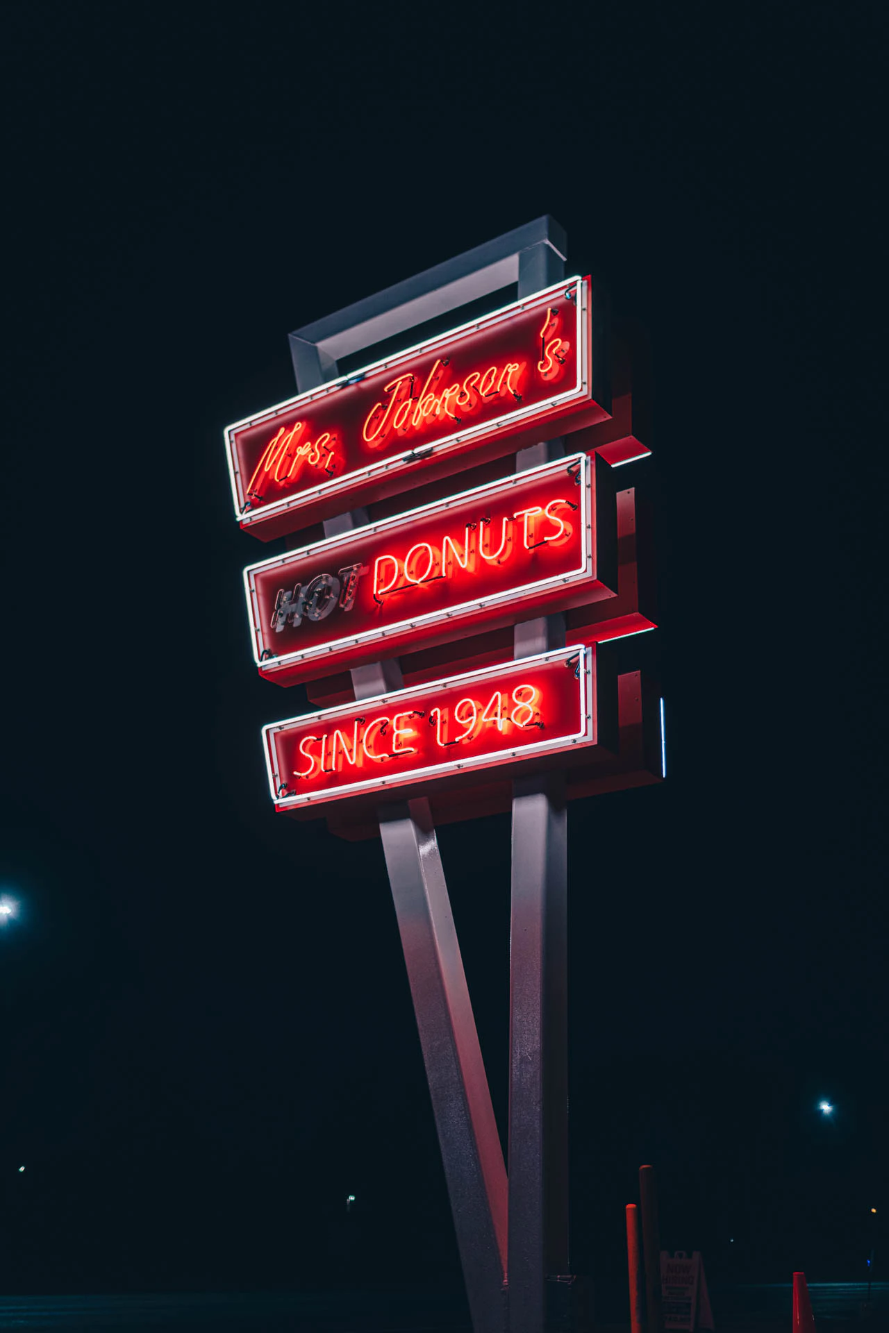 mrs Johnsons hot donuts neon sign in Austin Texas at night