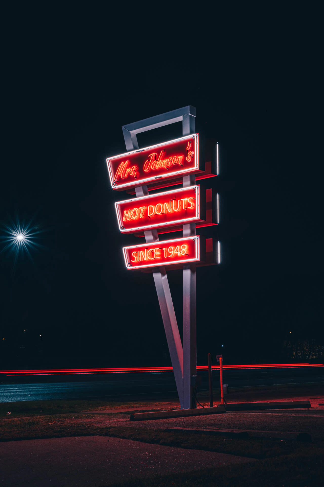 mrs Johnsons hot donuts neon sign in Austin Texas at night