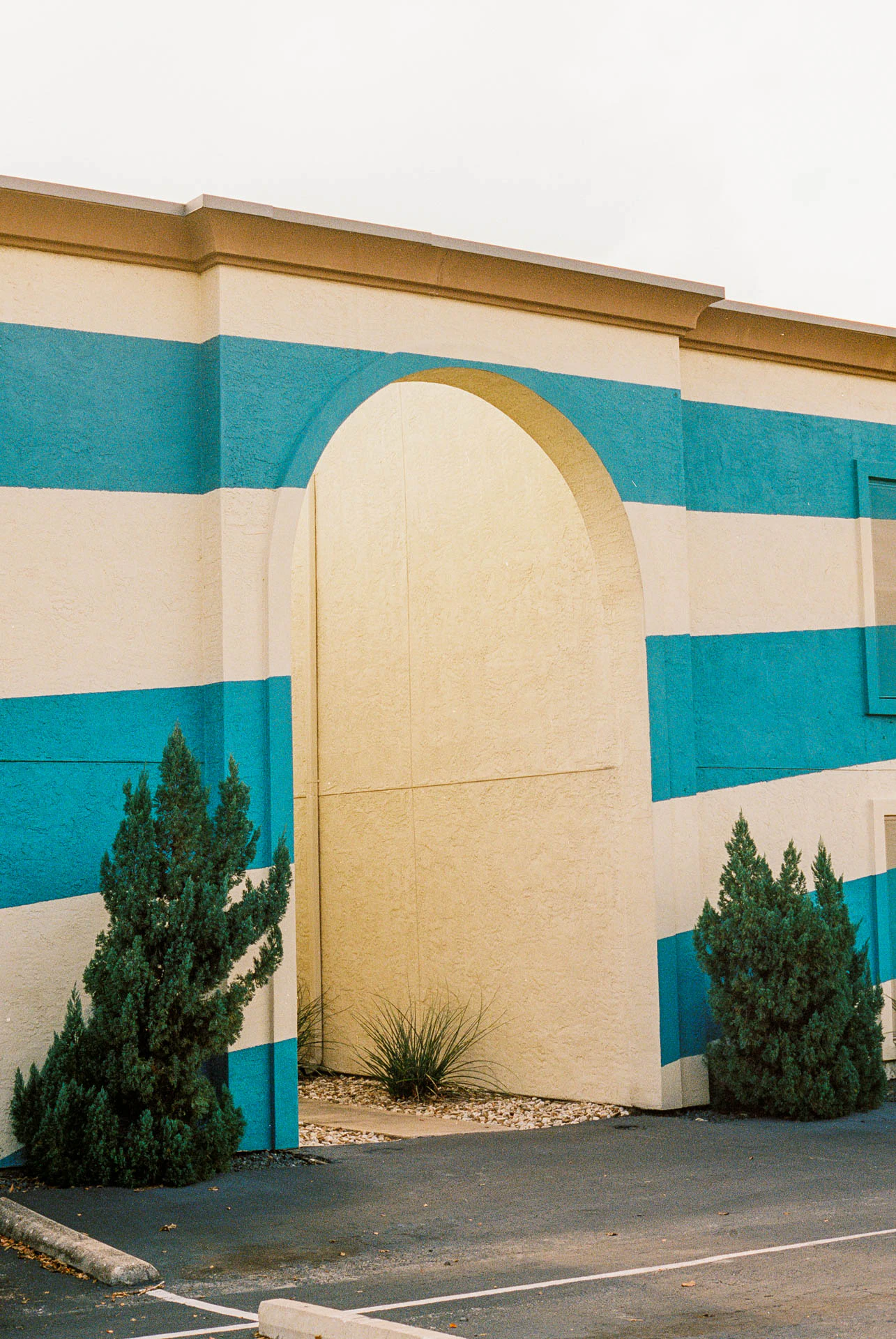 arched starburst entryway of apartment building on film