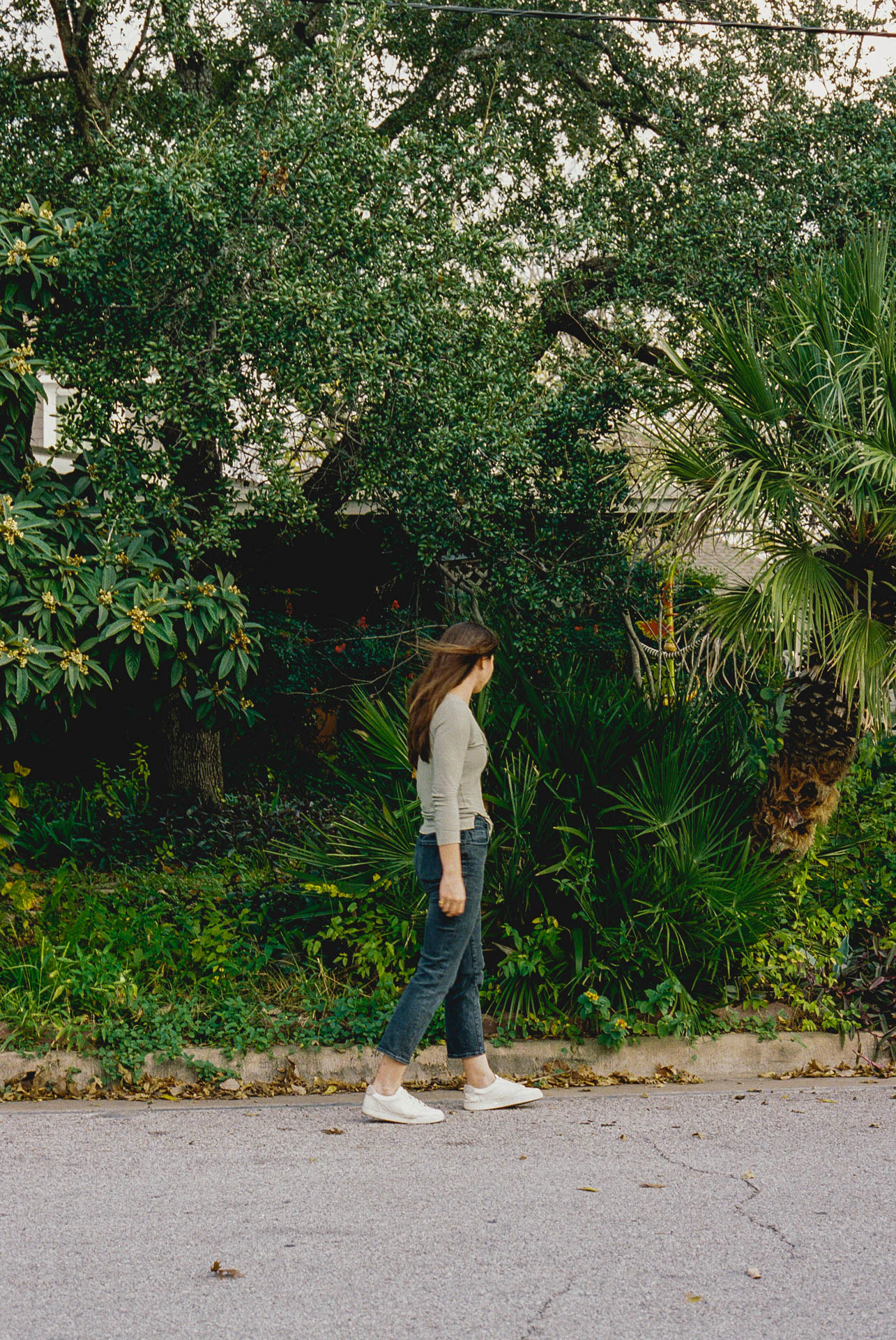 woman walking in Austin on film