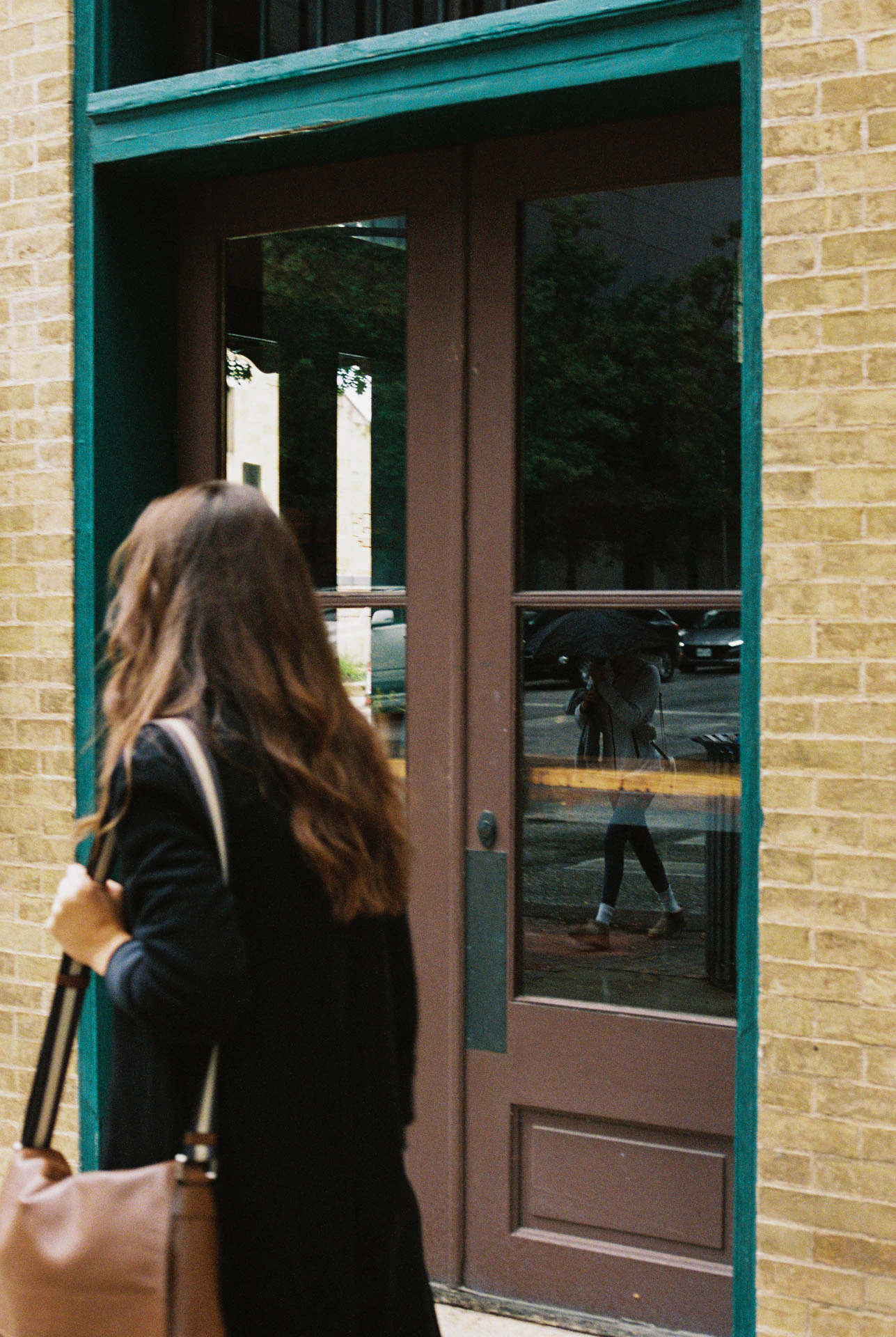 woman walking in Downtown Austin on film