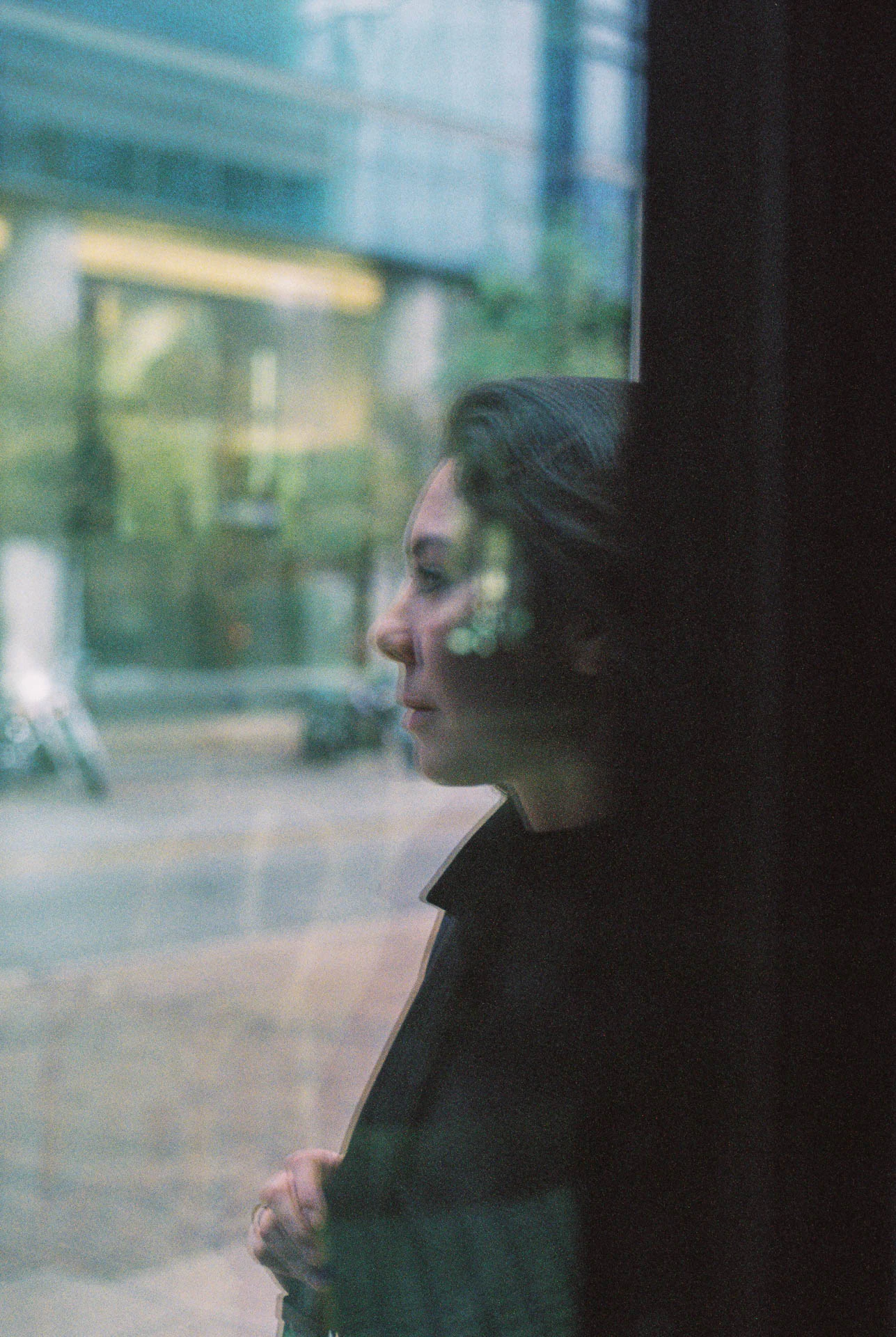 woman through a window in Downtown Austin on film
